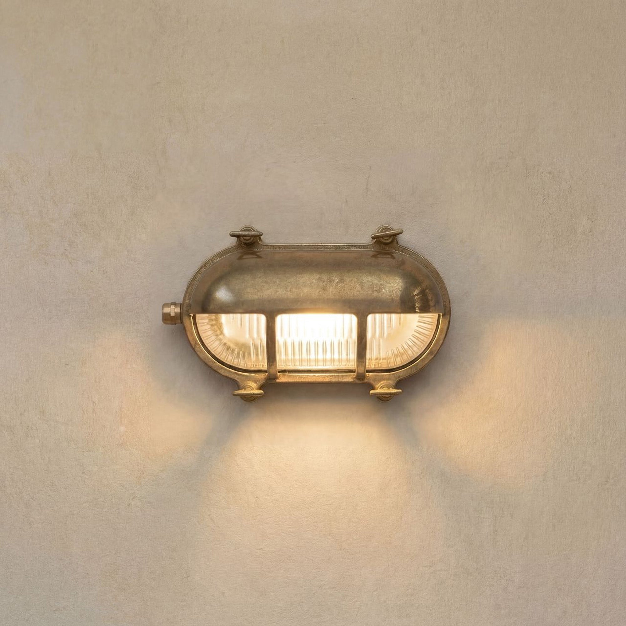 Navigator Palaemon Eyelid Bulkhead Wall Light - Raw Brass