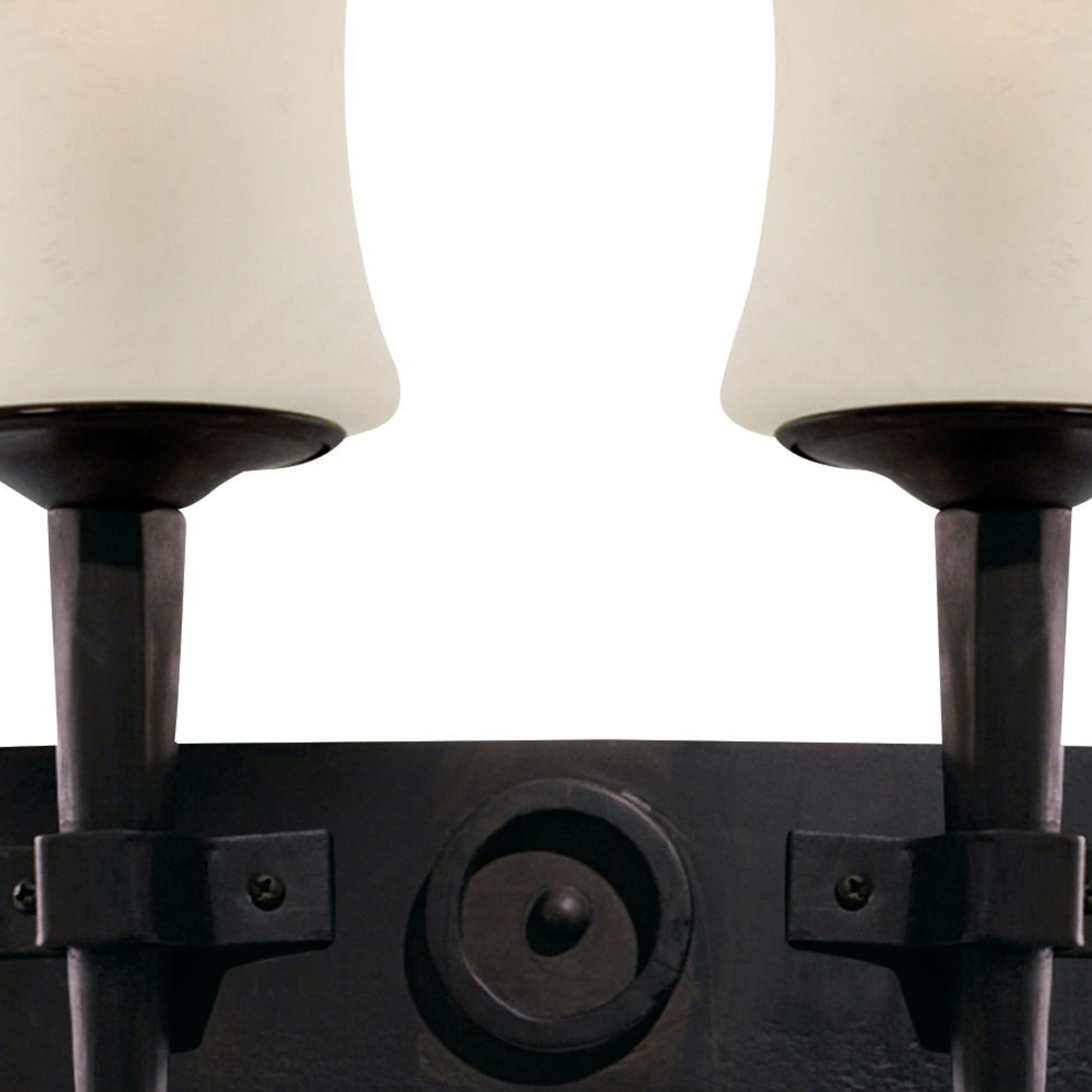 Close up of the Cartwheel wall light backplate showing the central turned roundel between the two glass shades
