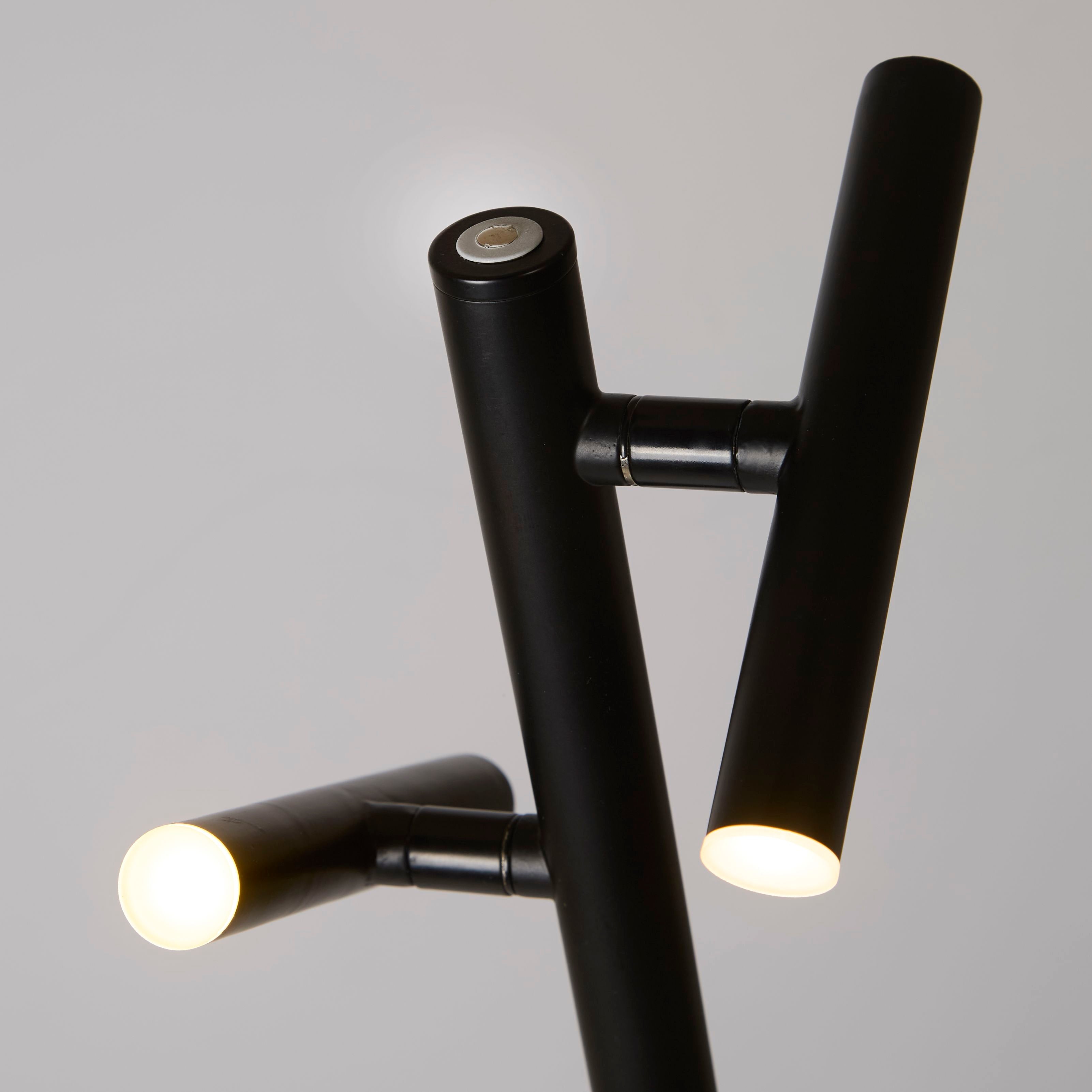 Close up of the two integrated LED heads and touch dimmer on the Searchlight Rechargeable 2 Light Floor Lamp