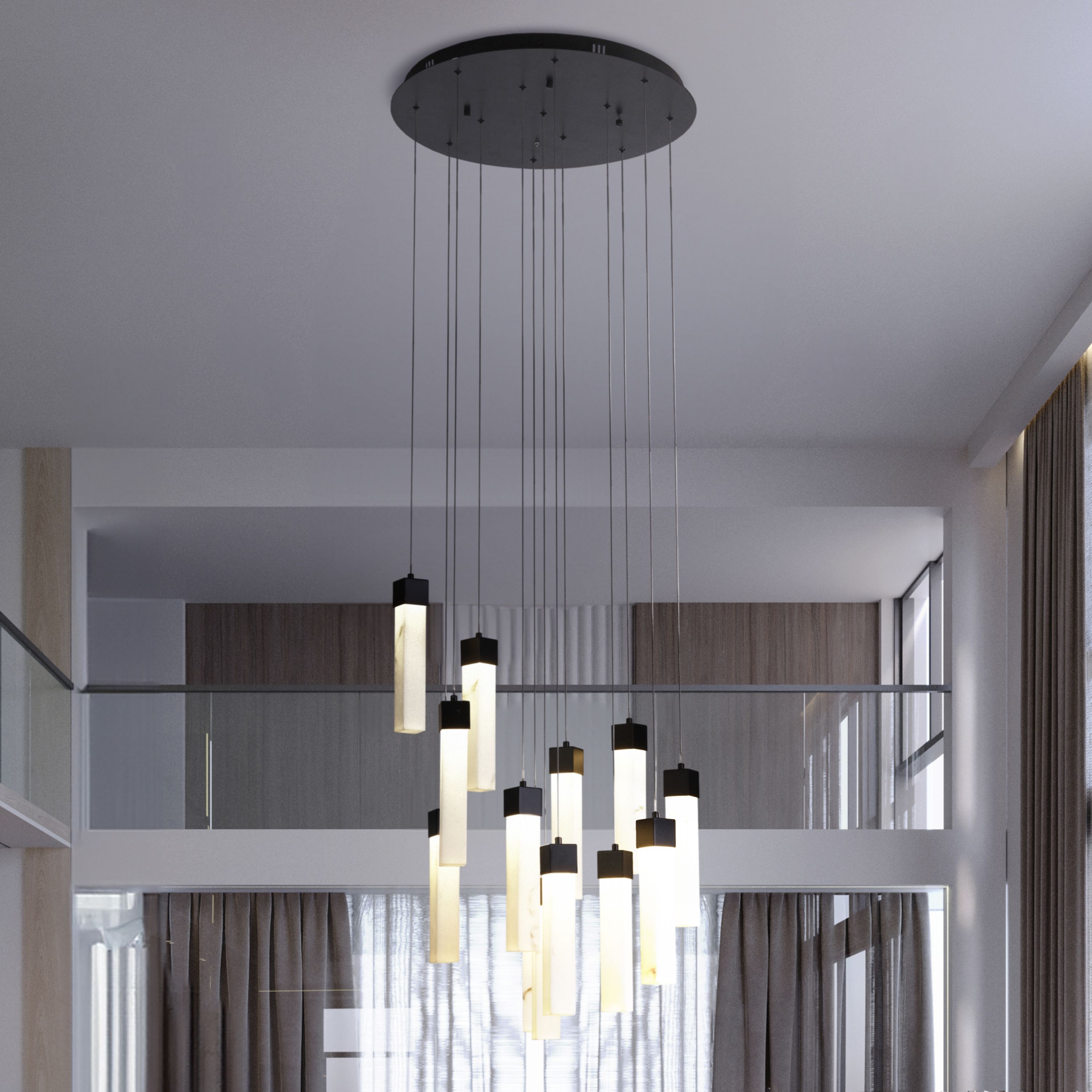Searchlight Moonbeam 13 Light Pendant in black with marble effect resin hanging in a double height hallway beside a glass staircase and mezzanine landing