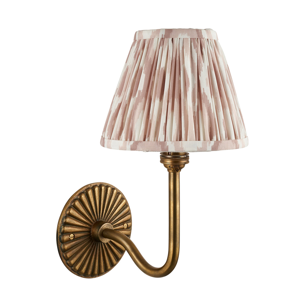 Endon Dahlia Swan antique brass wall light cut out on white, unlit, with the neutral pink ikat pleated shade over the lamp holder
