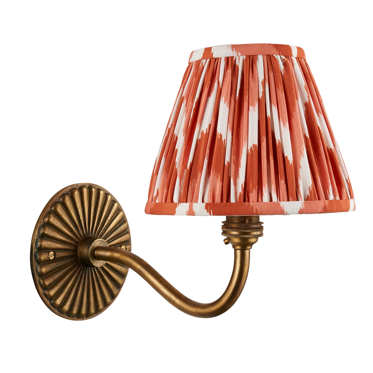 Endon Dahlia Curve wall light with fluted antique brass backplate and apricot orange zigzag shade, unlit product shot on white