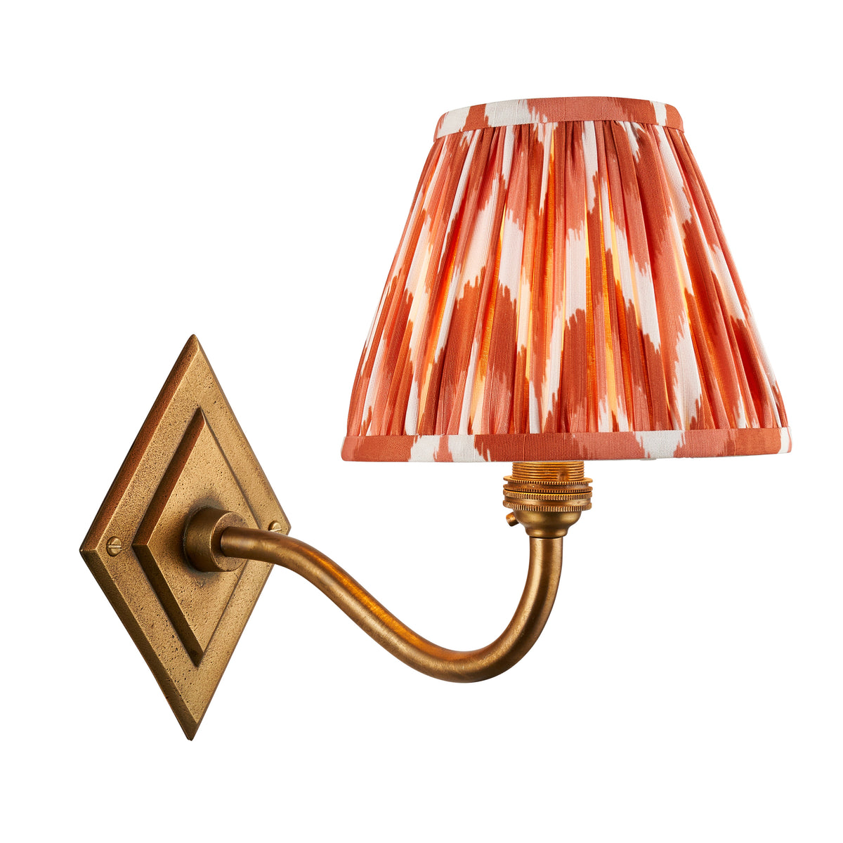Endon Diamond Curve wall light in antique brass with apricot orange zigzag pleated shade, unlit, cut out on a white background
