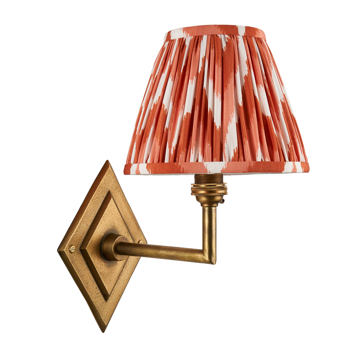 Endon Diamond Angle wall light cut out on white, shade unlit, antique brass diamond backplate with right angled arm and apricot orange zigzag shade