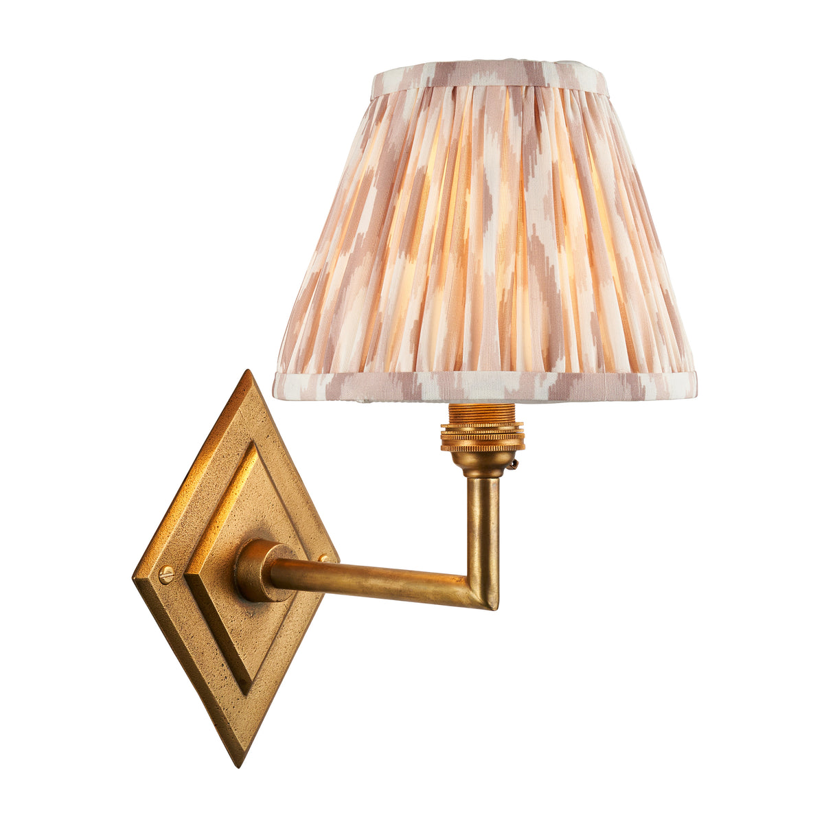 Endon Diamond Angle wall light unlit on a white background, antique brass diamond backplate and angled arm with a pleated neutral ikat shade