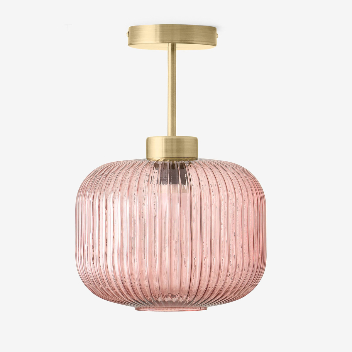 MADE Briz flush ceiling light in antique brass with ribbed pink glass shade, studio shot from the front
