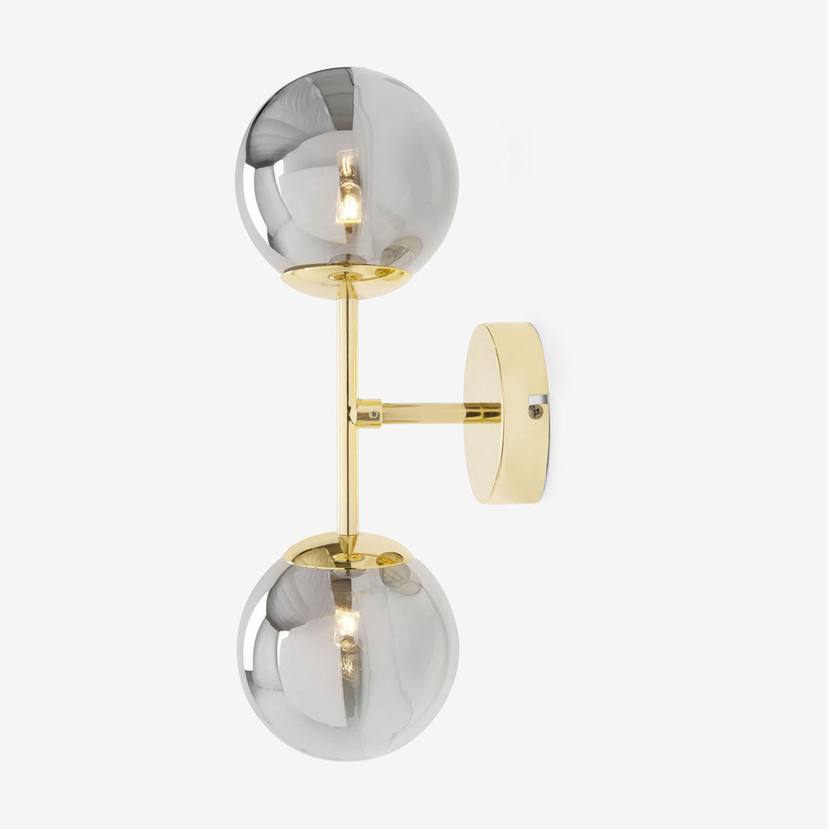 MADE Globe wall light in polished brass with two smoke grey globes, studio shot from the side
