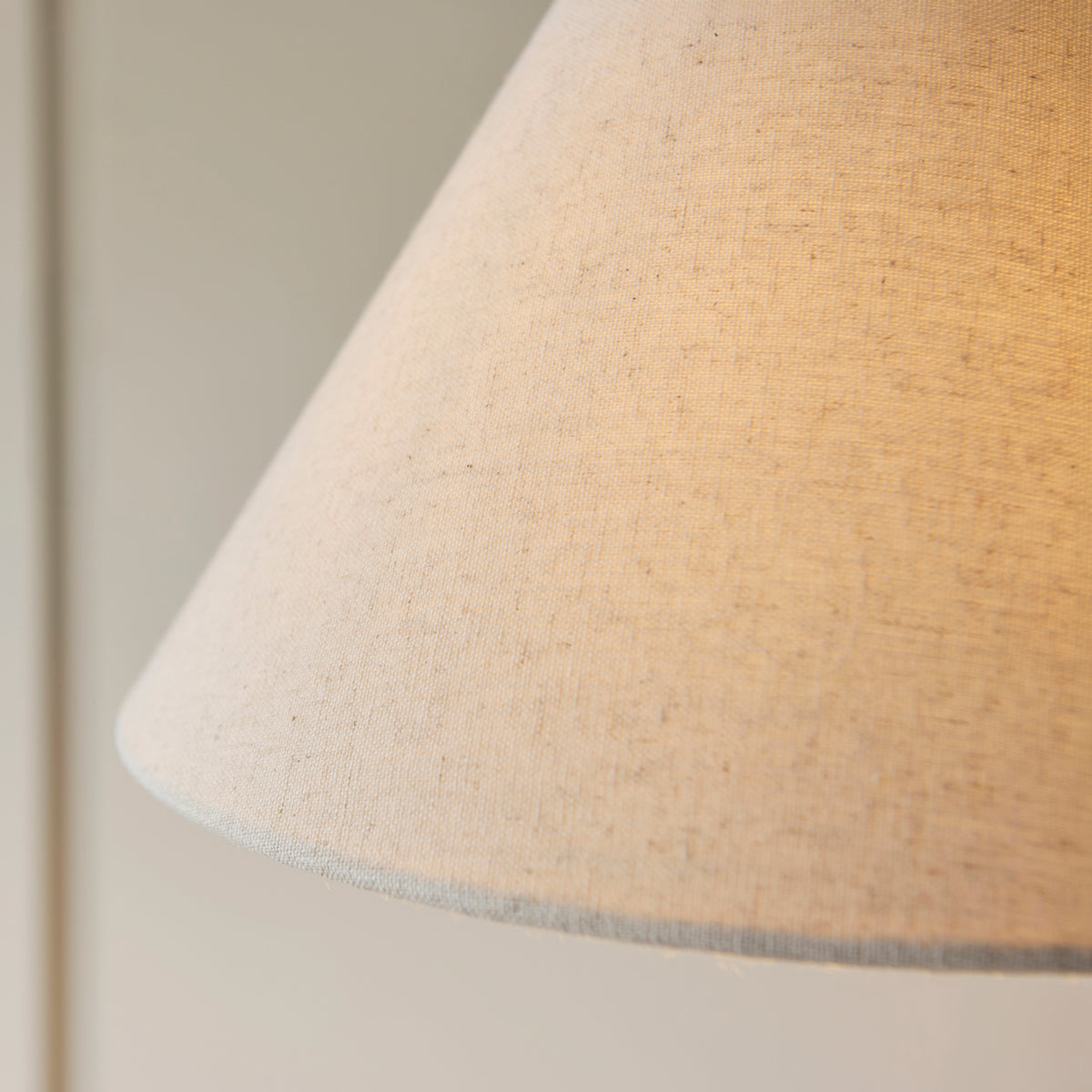 Close up shot of the brushed aged brass switch and stem joint of the Endon Wallbridge floor light