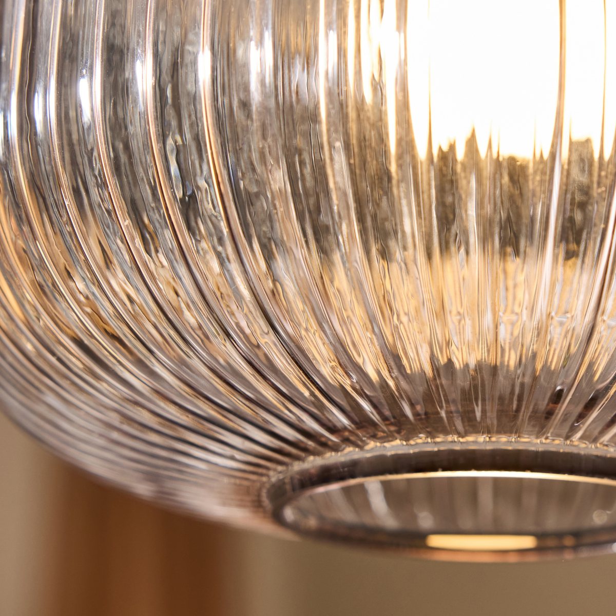 MADE Briz flush ceiling light close up of the ribbed glass texture and open lower rim