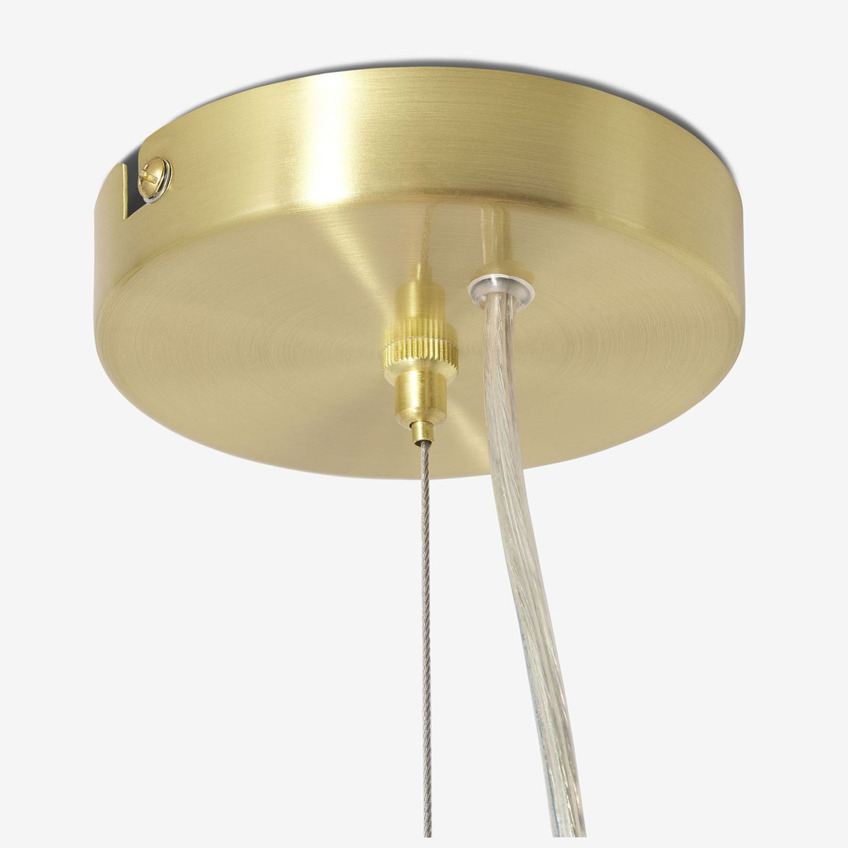 Underside of brushed brass ceiling plate and suspension cable on MADE Globe chandelier