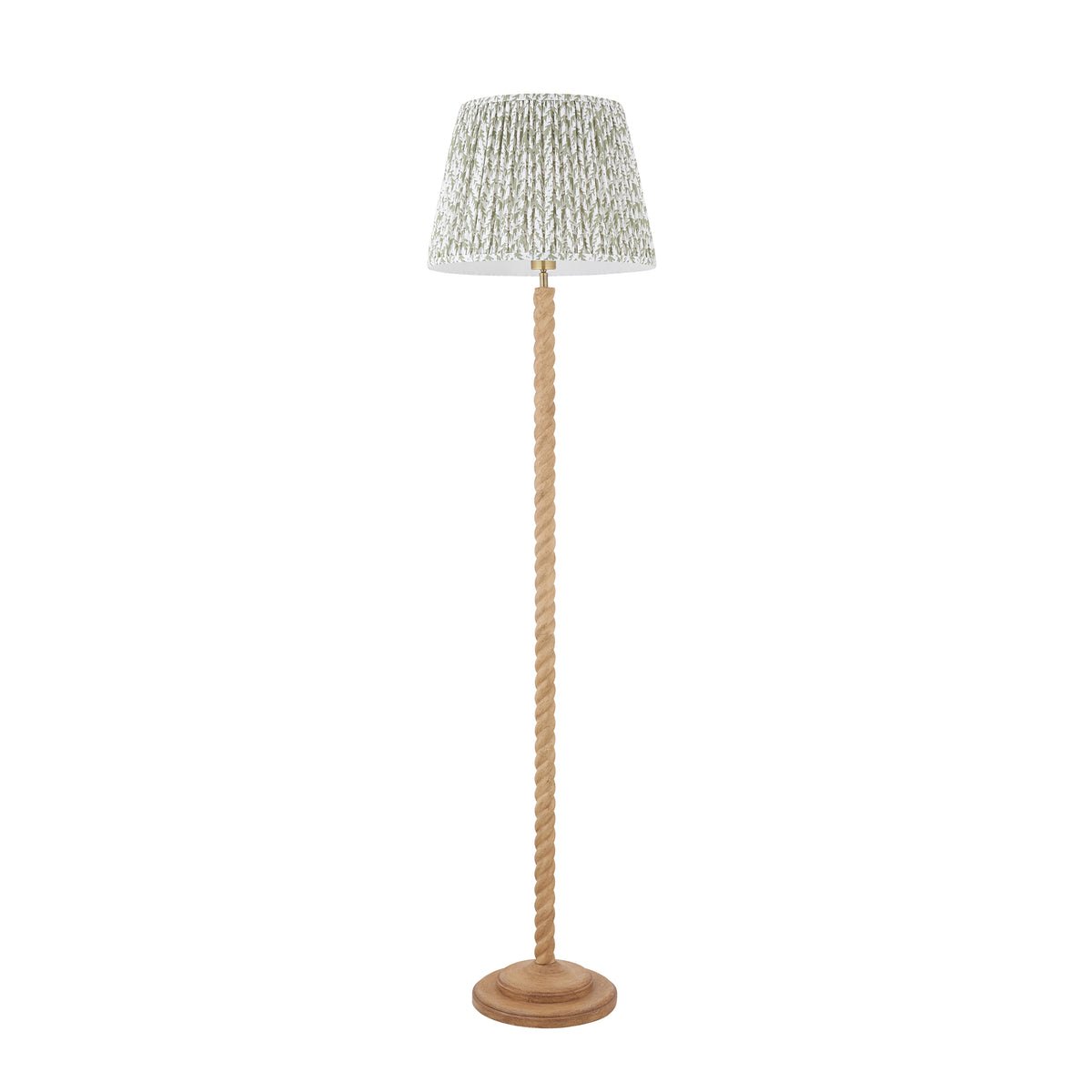 Endon Twist floor lamp unlit, cut out on white, oak effect twisted stem with the 40cm green leaf print pleated shade