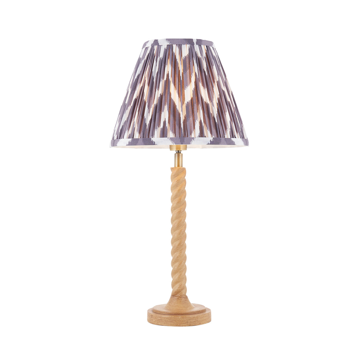 Endon Twist table lamp in oak effect resin with a pearl grey zigzag pleated shade, lit, cut out on white