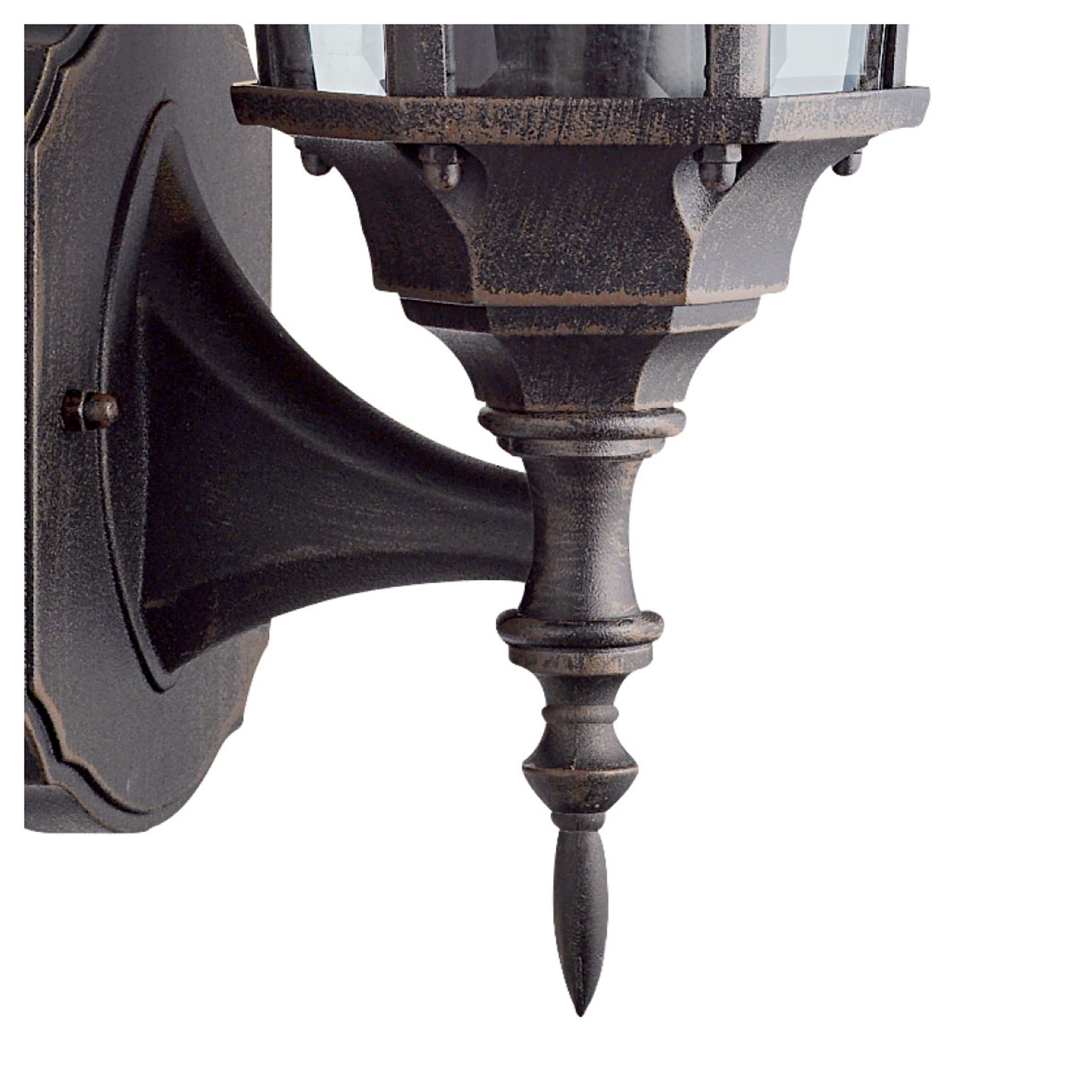Close up of the Capri Outdoor Uplight's wall mounting bracket and drop finial, showing the rustic brown finish detail
