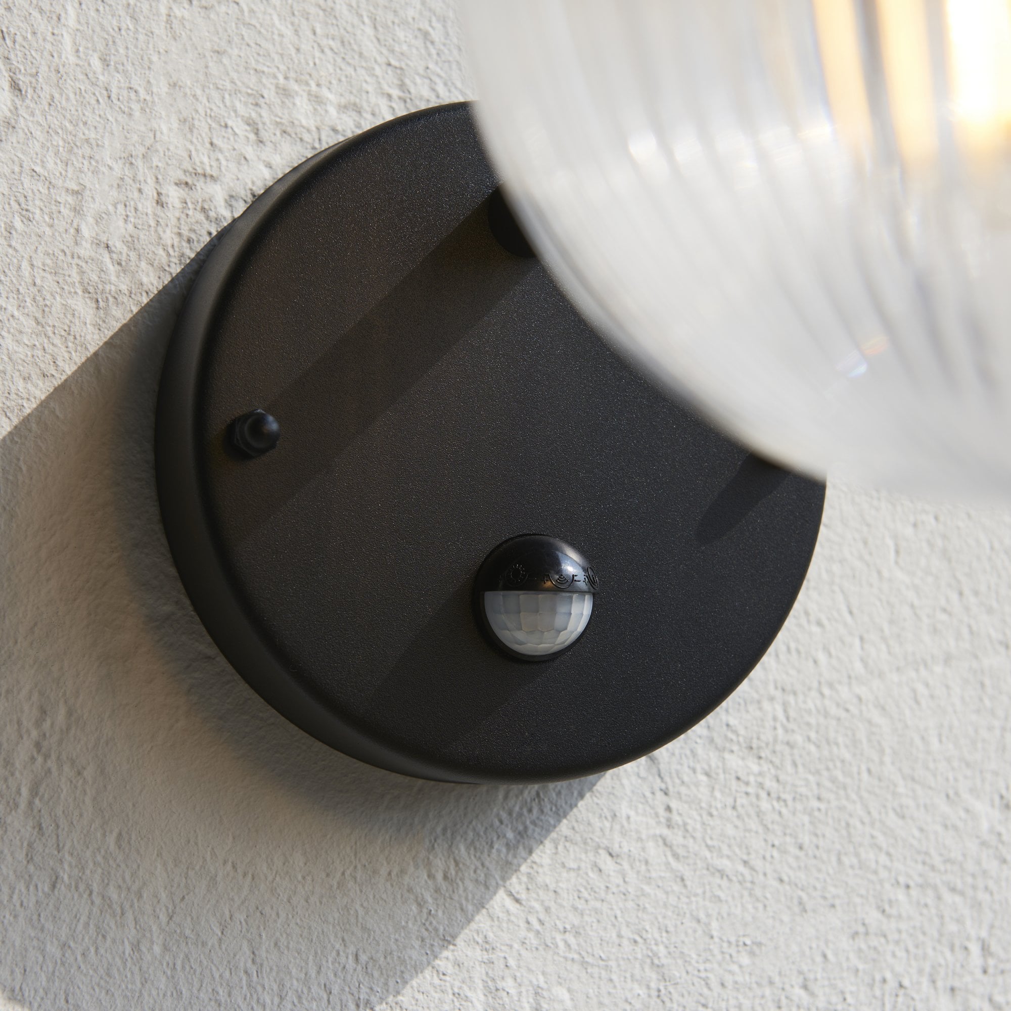 Endon Eldon Single Wall Light with PIR - Textured Black & Clear Ribbed Glass