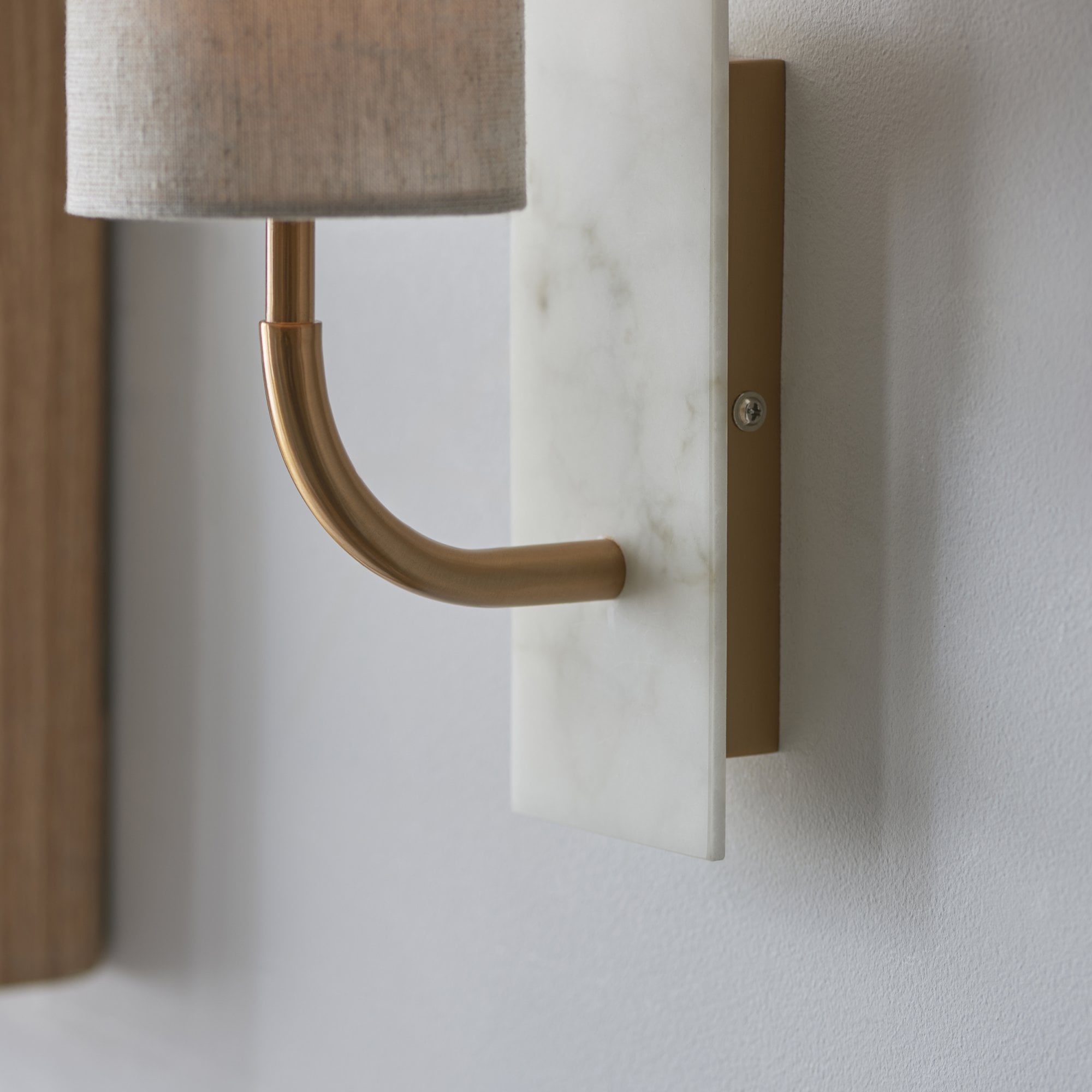 Utopia Spire Single White Marble Curved Arm Wall Light - Vintage Brass & Natural Cylindrical Shade