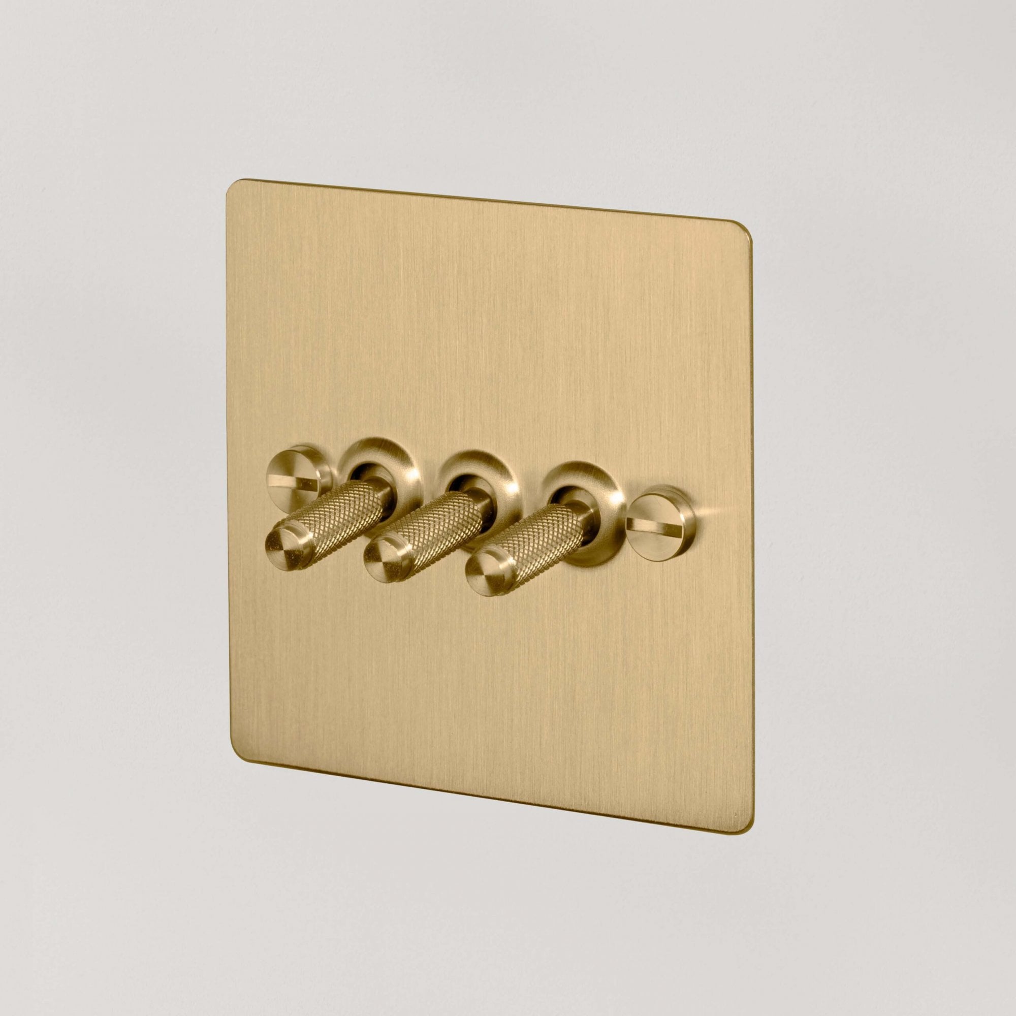 Buster + Punch 3G Toggle Light Switch - Brass Back Plate & Brass Cross Knurl Pattern