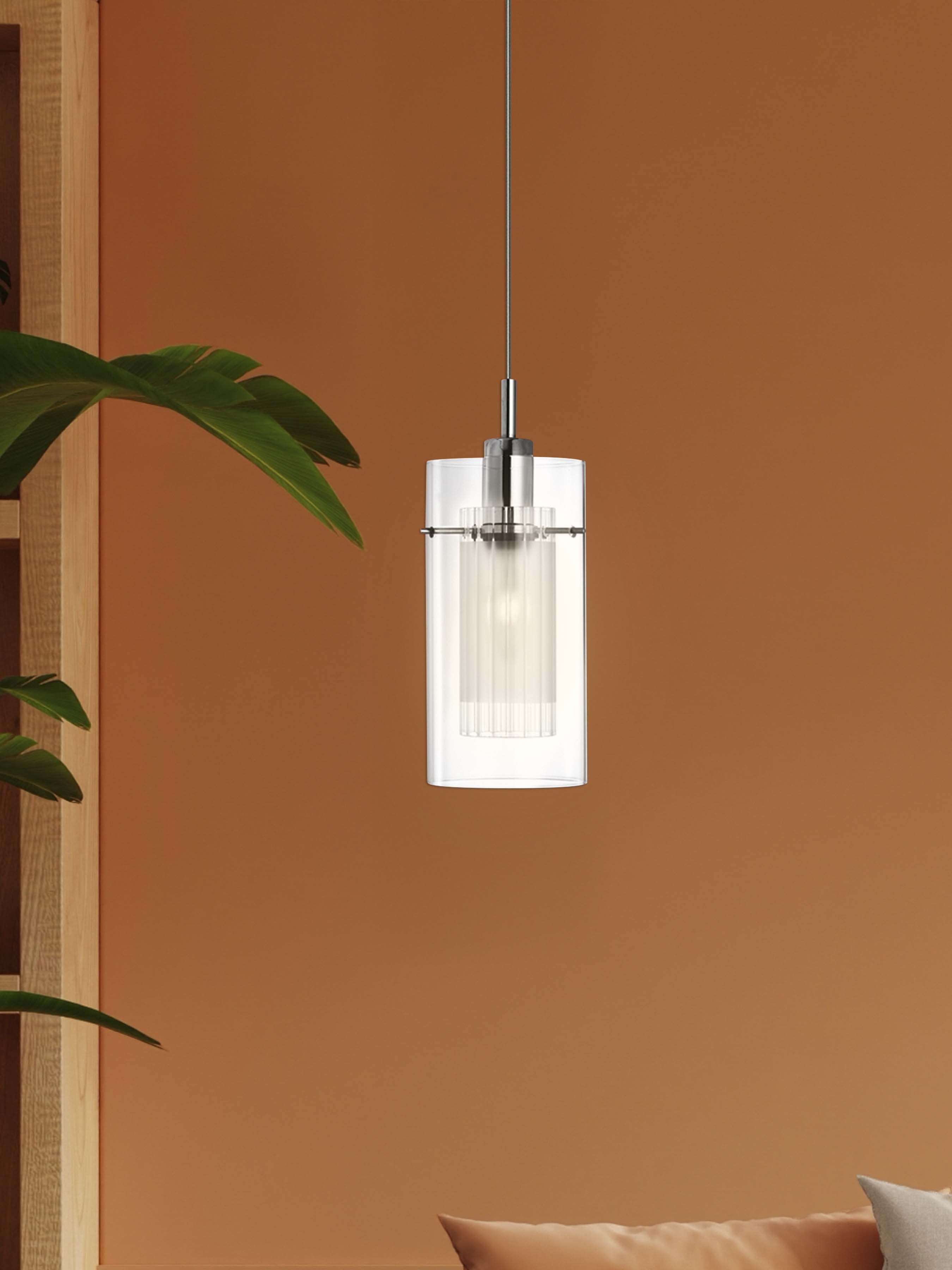 Searchlight Duo I pendant in chrome and double glass hanging against a terracotta orange wall next to a potted palm