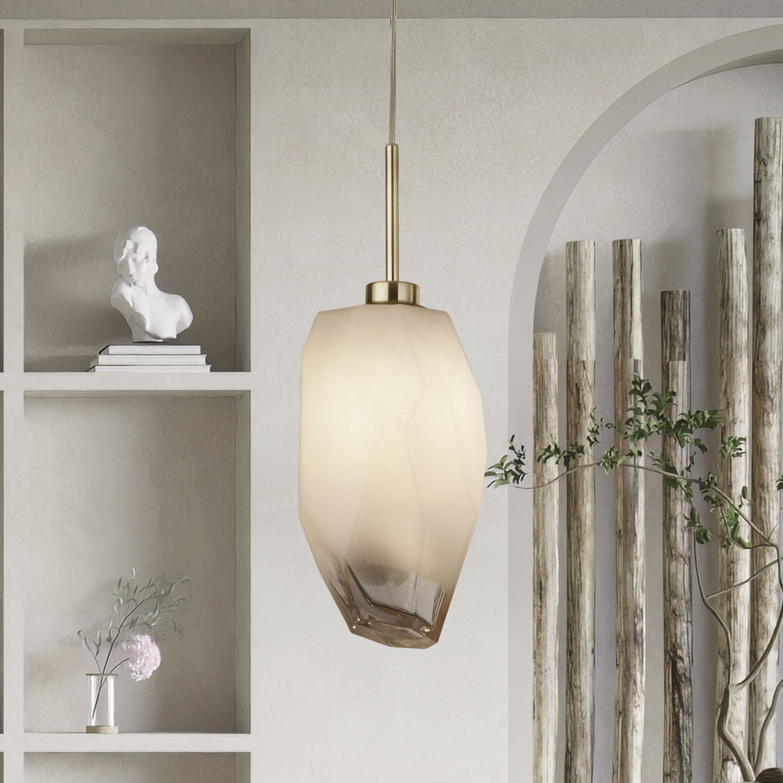 Rocky 1 light pendant hung beside a shelving alcove with a plaster bust and potted plants, shade lit