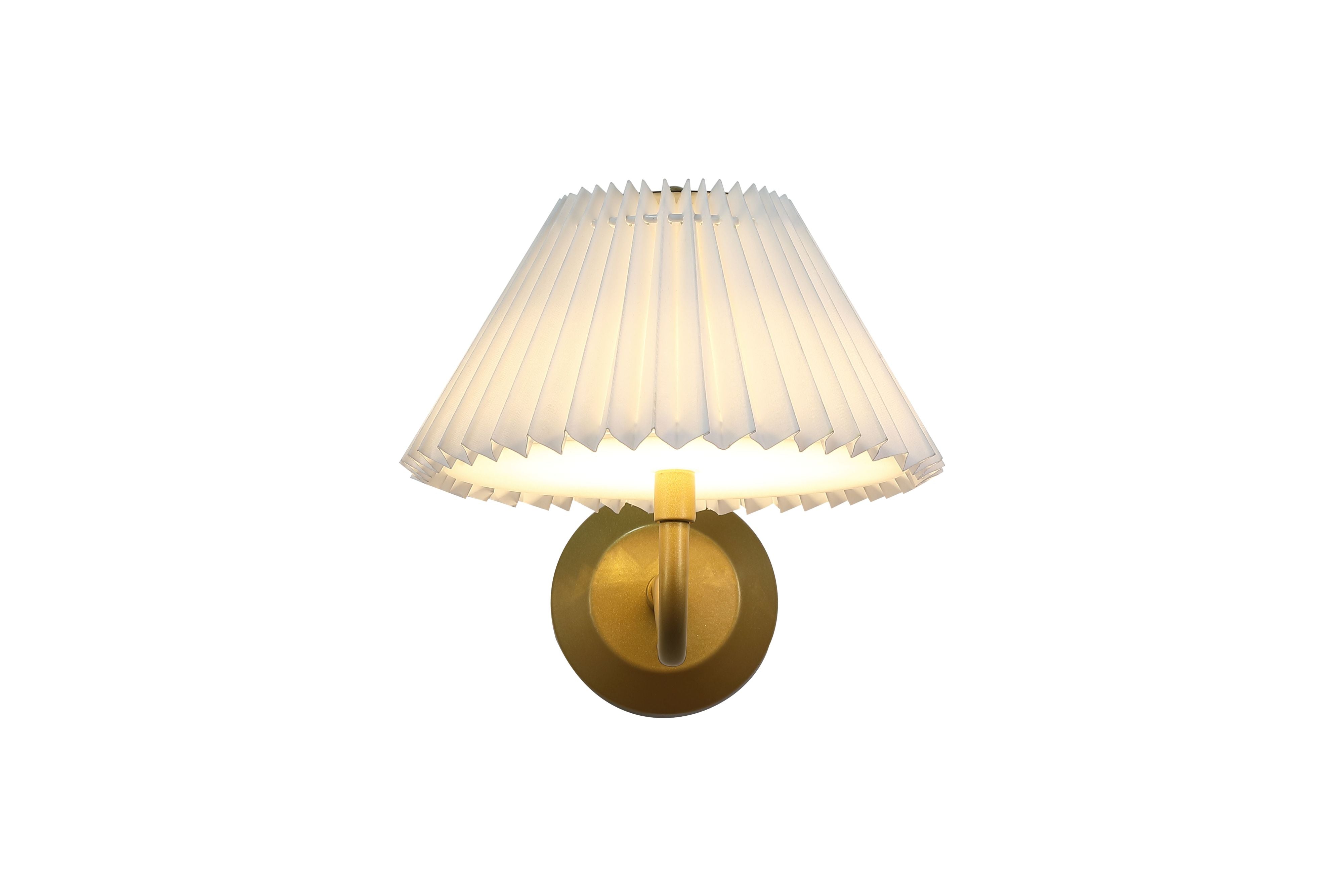 Front view of the Danish rechargeable wall light in gold with a white pleated shade, illuminated with a warm glow