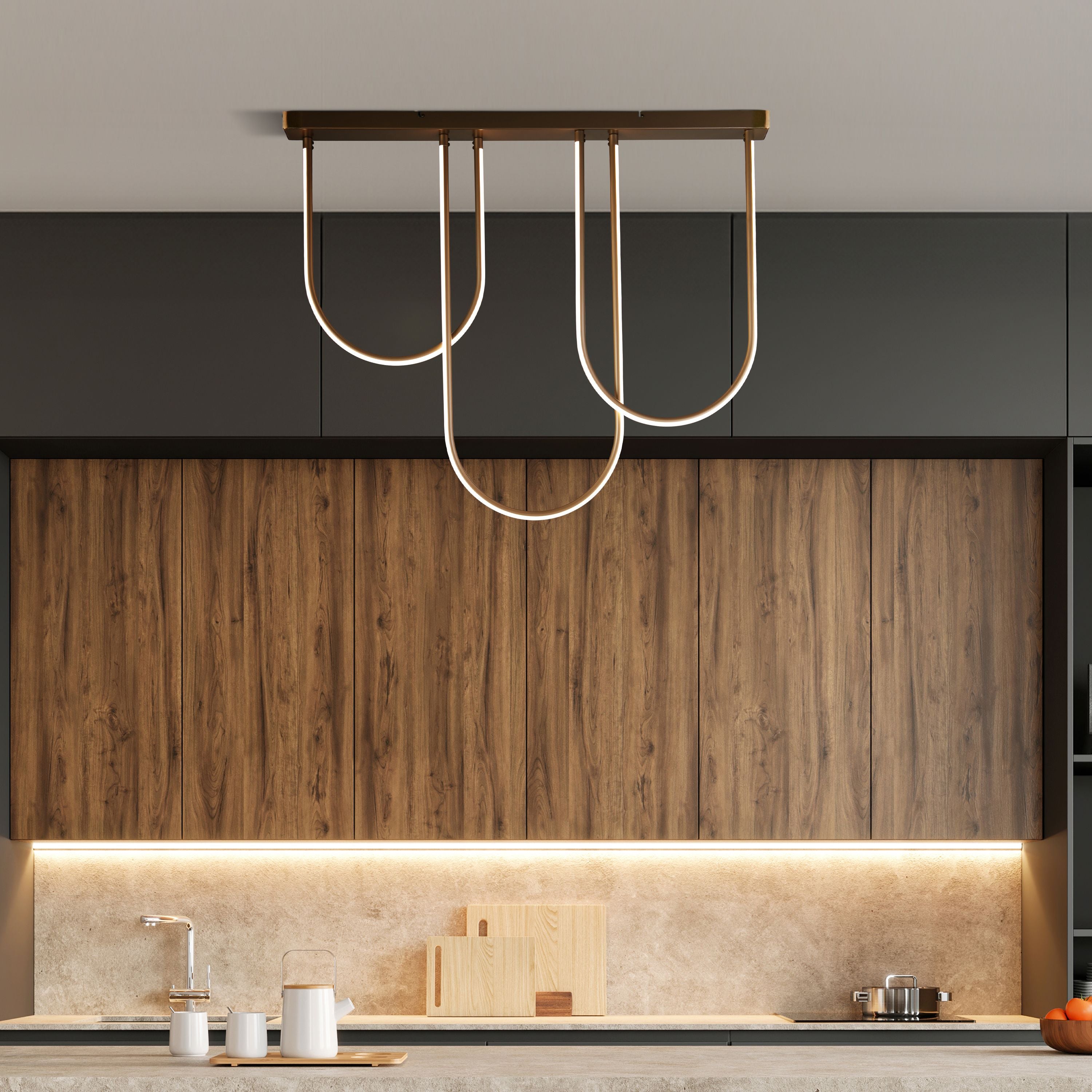 Searchlight Chime LED Flush in bronze effect metal installed above a kitchen island in a modern kitchen with dark cabinetry and wood panelling, LED arms lit with a warm glow