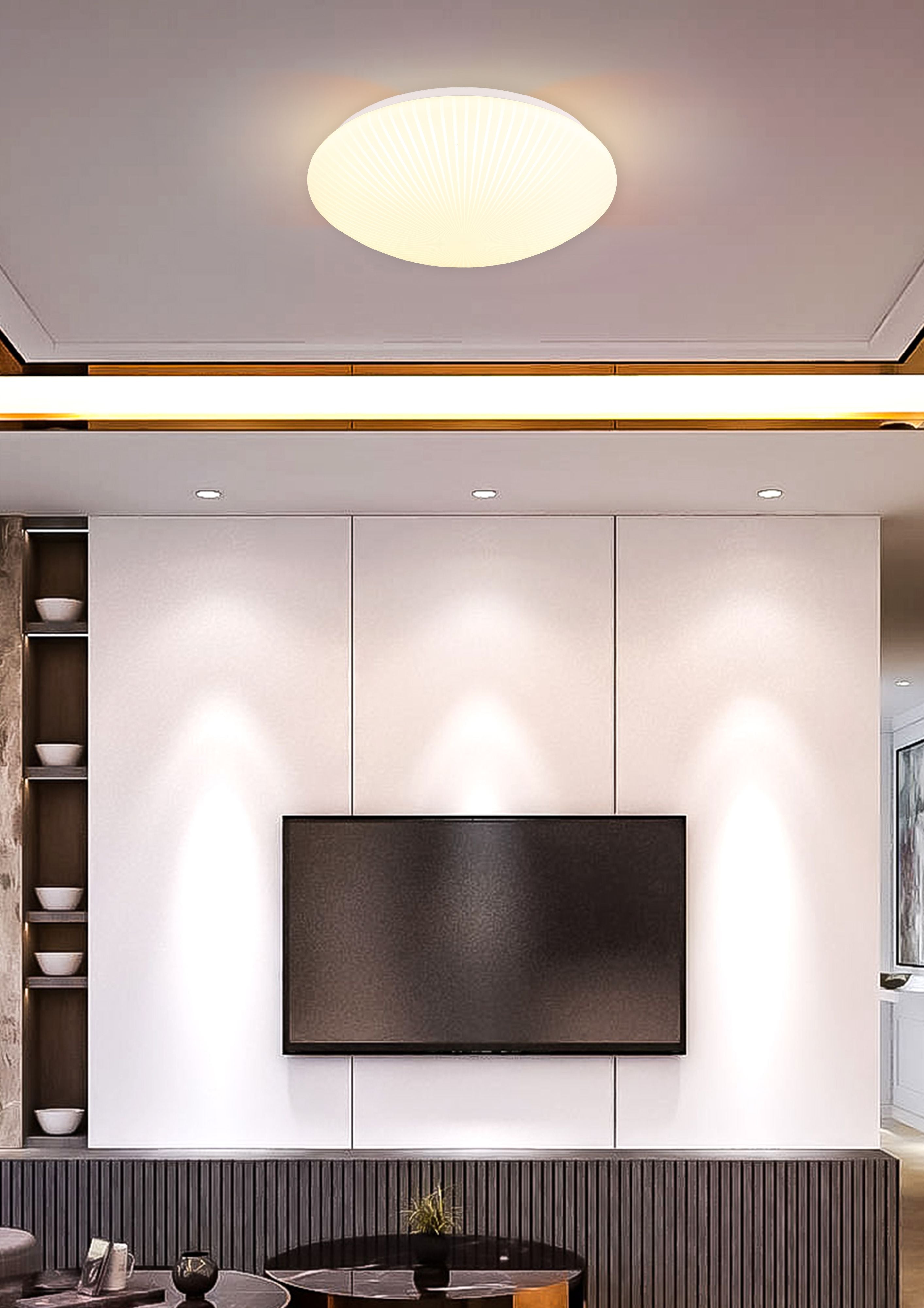 Searchlight Malta LED flush ceiling light 38.5cm in white acrylic, styled on the ceiling of a living room above a wall mounted TV