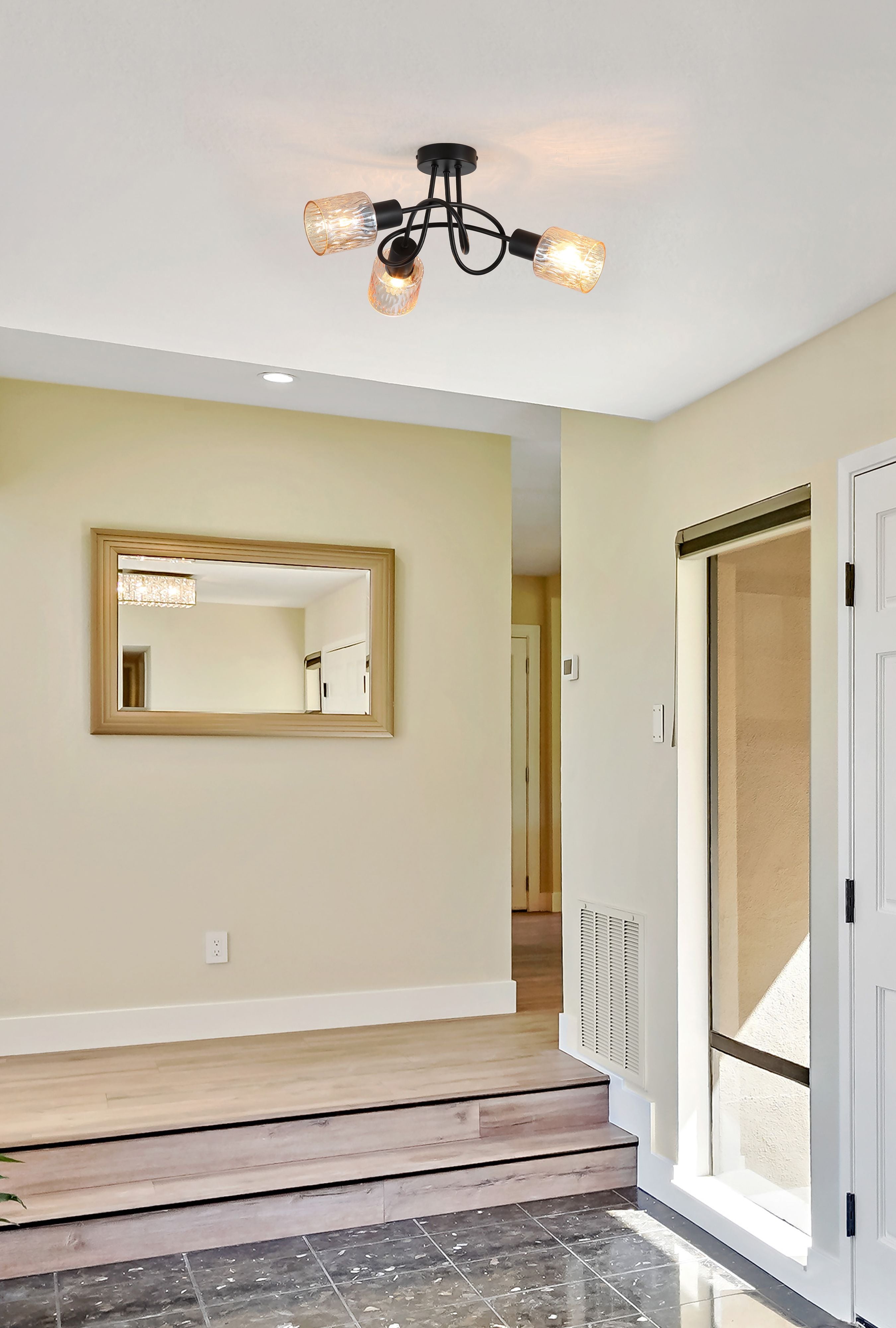 Searchlight Knot 3 Light Ceiling Lamp in matte black with amber glass shades styled in a hallway above a console table