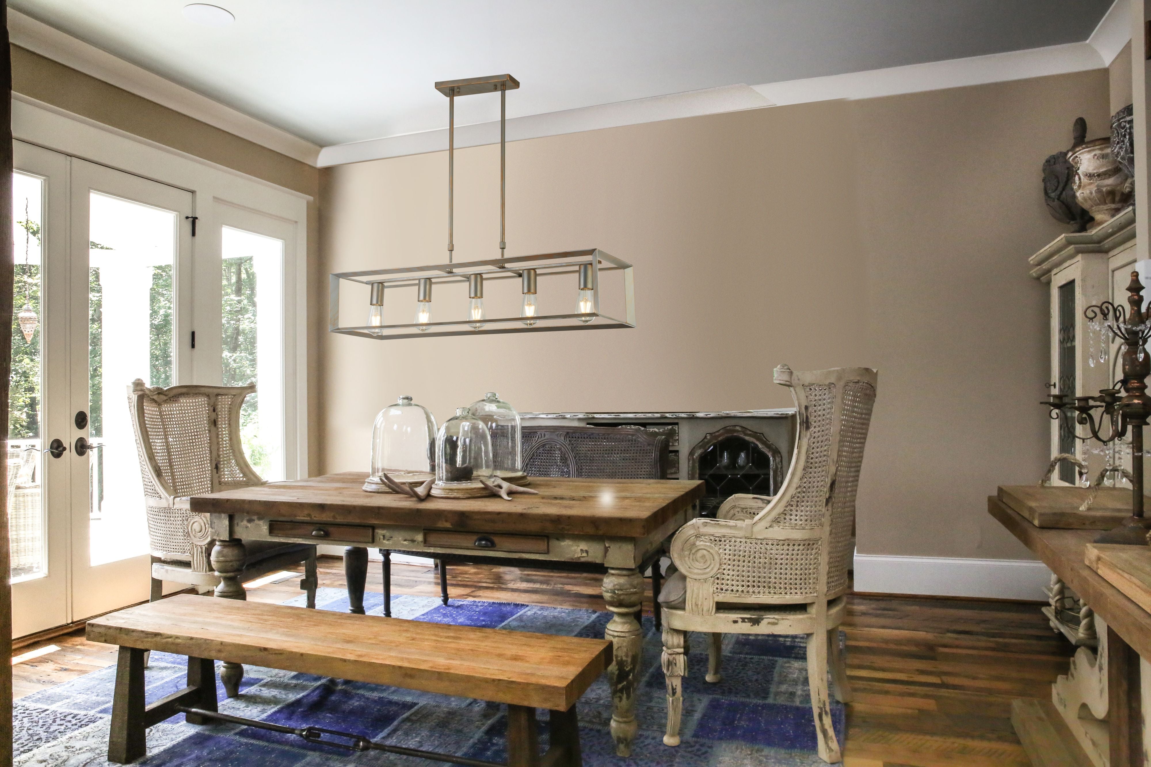 Searchlight Heaton 5 Light Pendant styled above a rustic wooden dining table in a farmhouse style dining room