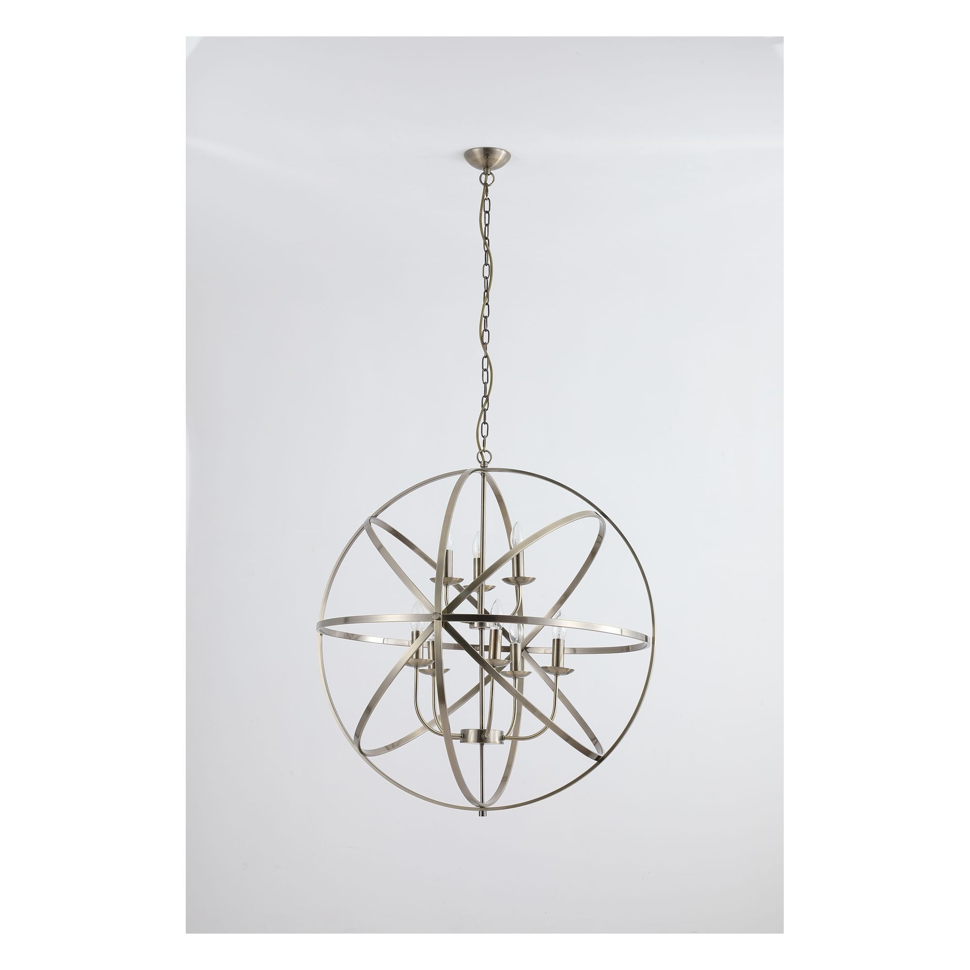 Searchlight Orbit 8 light pendant in antique brass metal, shown with the full length suspension chain on a plain white background