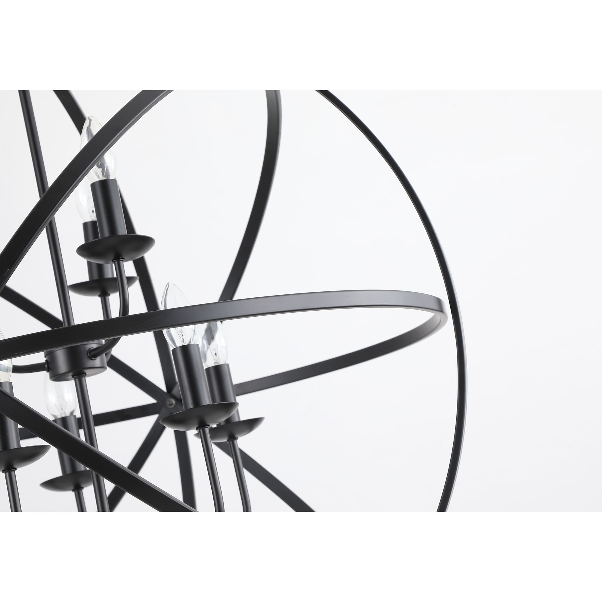 Close up of the Orbit pendant's matt black frame showing the candle style bulb holders and crossing metal rings