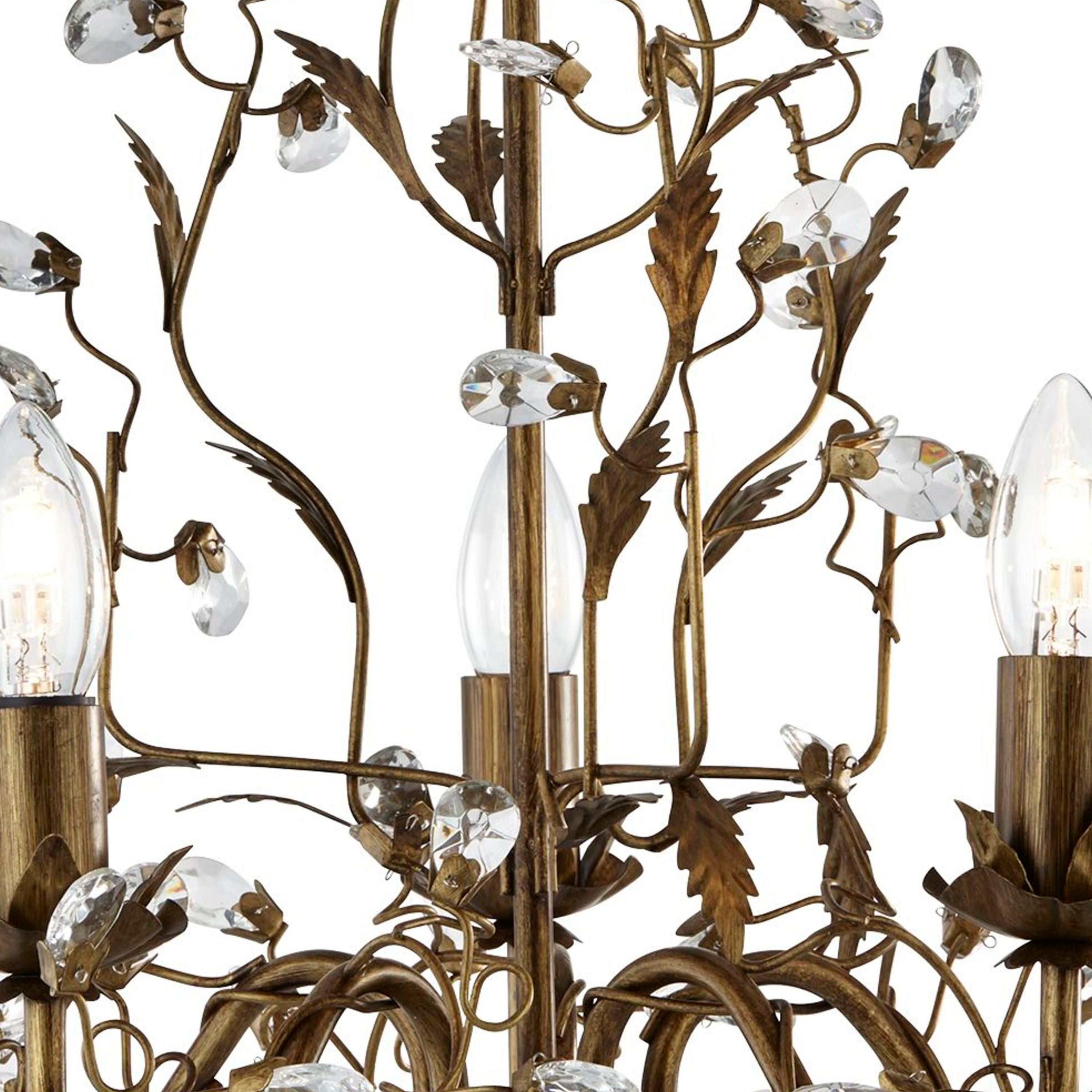 Close up of the Almandite pendant showing branching metal stems, leaf details and faceted crystal glass drops