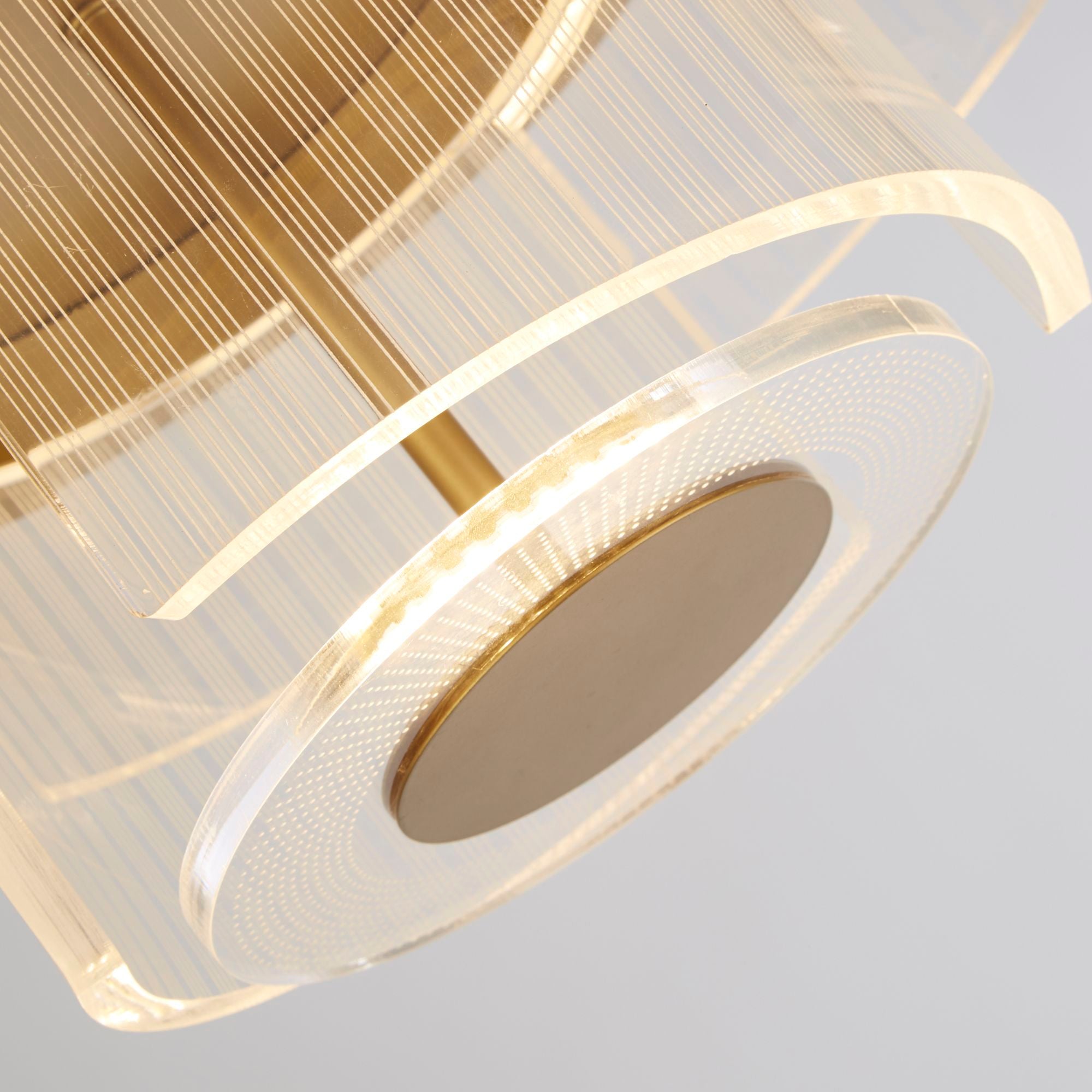 Close up of the Searchlight Deco underside, showing the ribbed clear acrylic tiers and the lit LED ring around the base disc