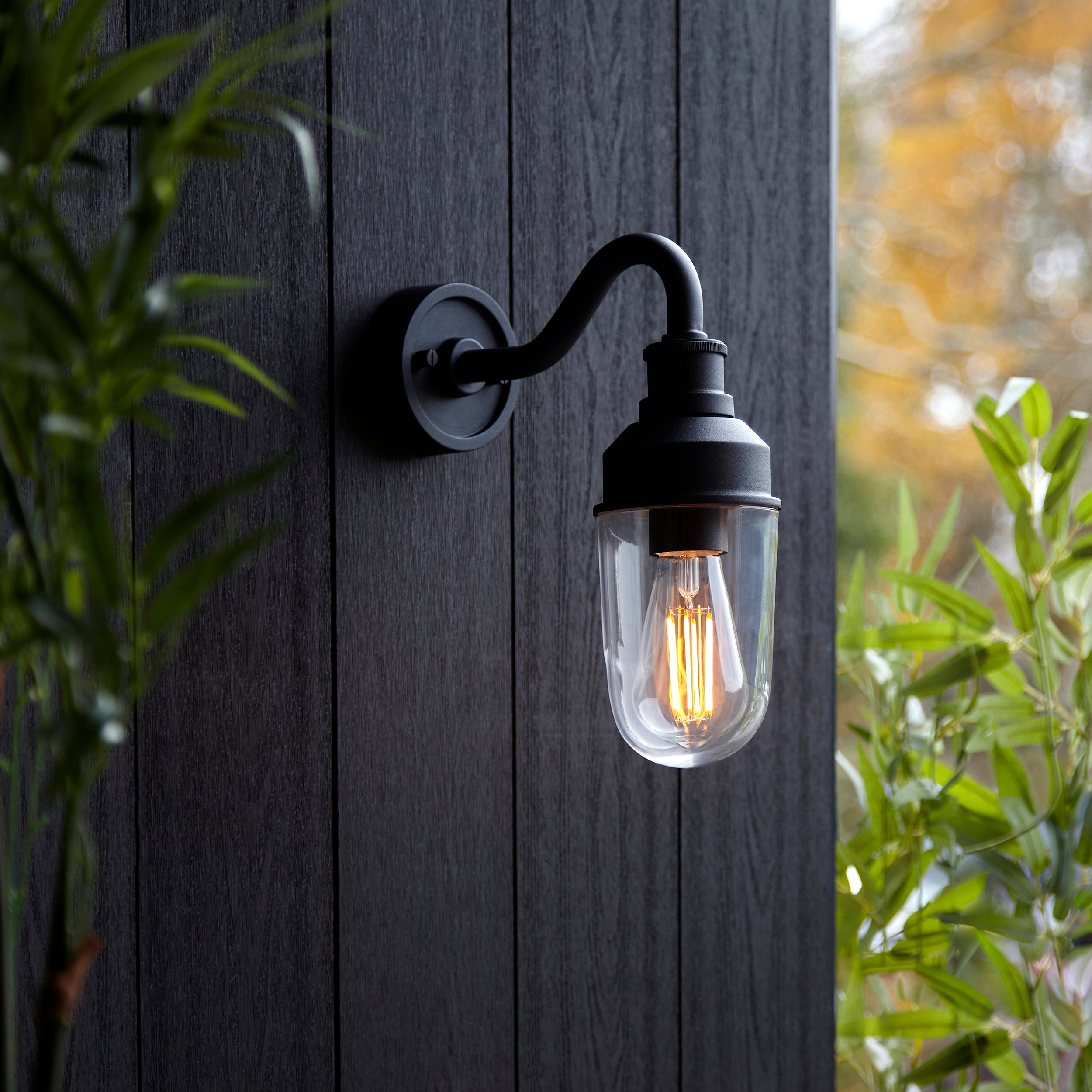 Utopia Frontier Curved Arm Wall Light - Textured Black & Clear Glass