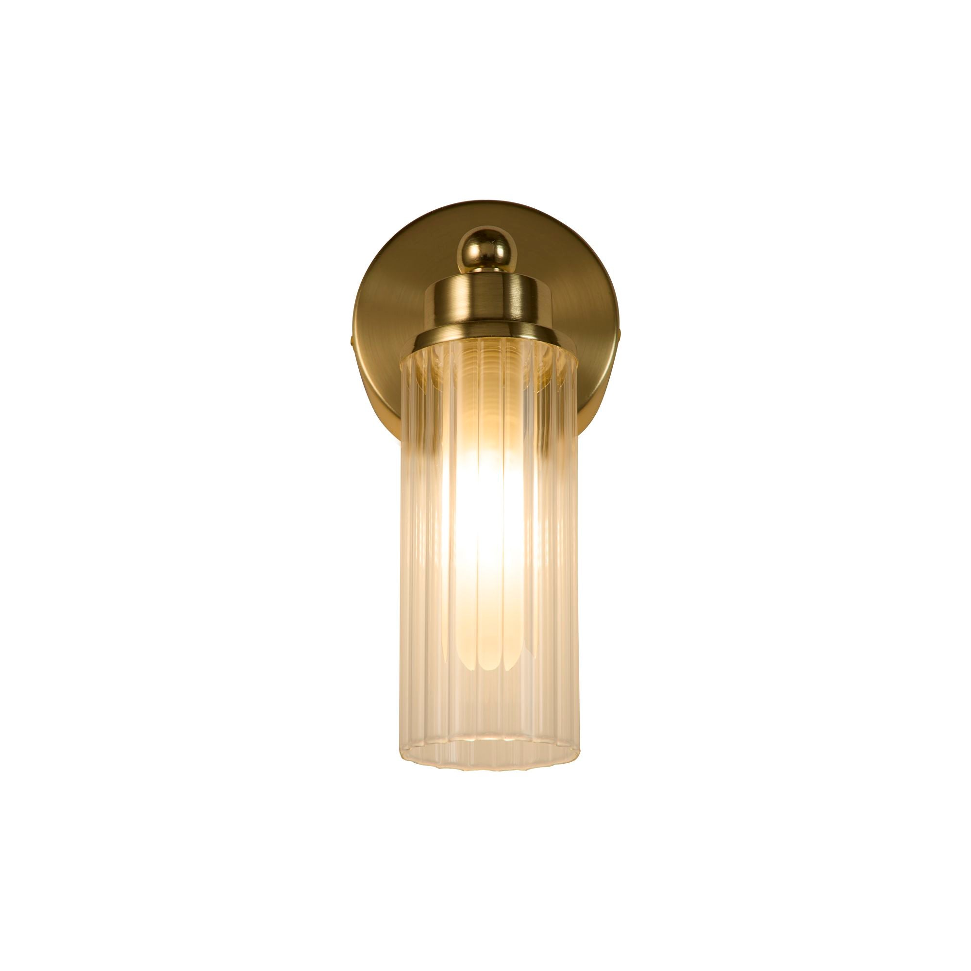 Searchlight Imperial 1 light wall light in satin brass with clear ribbed glass shade, lit, straight on studio shot
