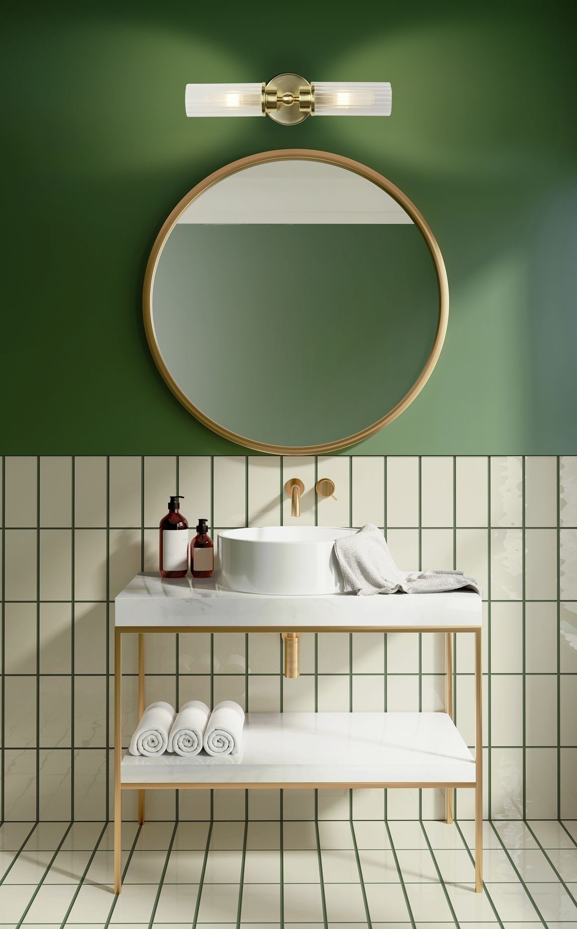 Searchlight Imperial 2 Light Wall Light in satin brass styled above a round mirror in a green tiled bathroom, mounted horizontally