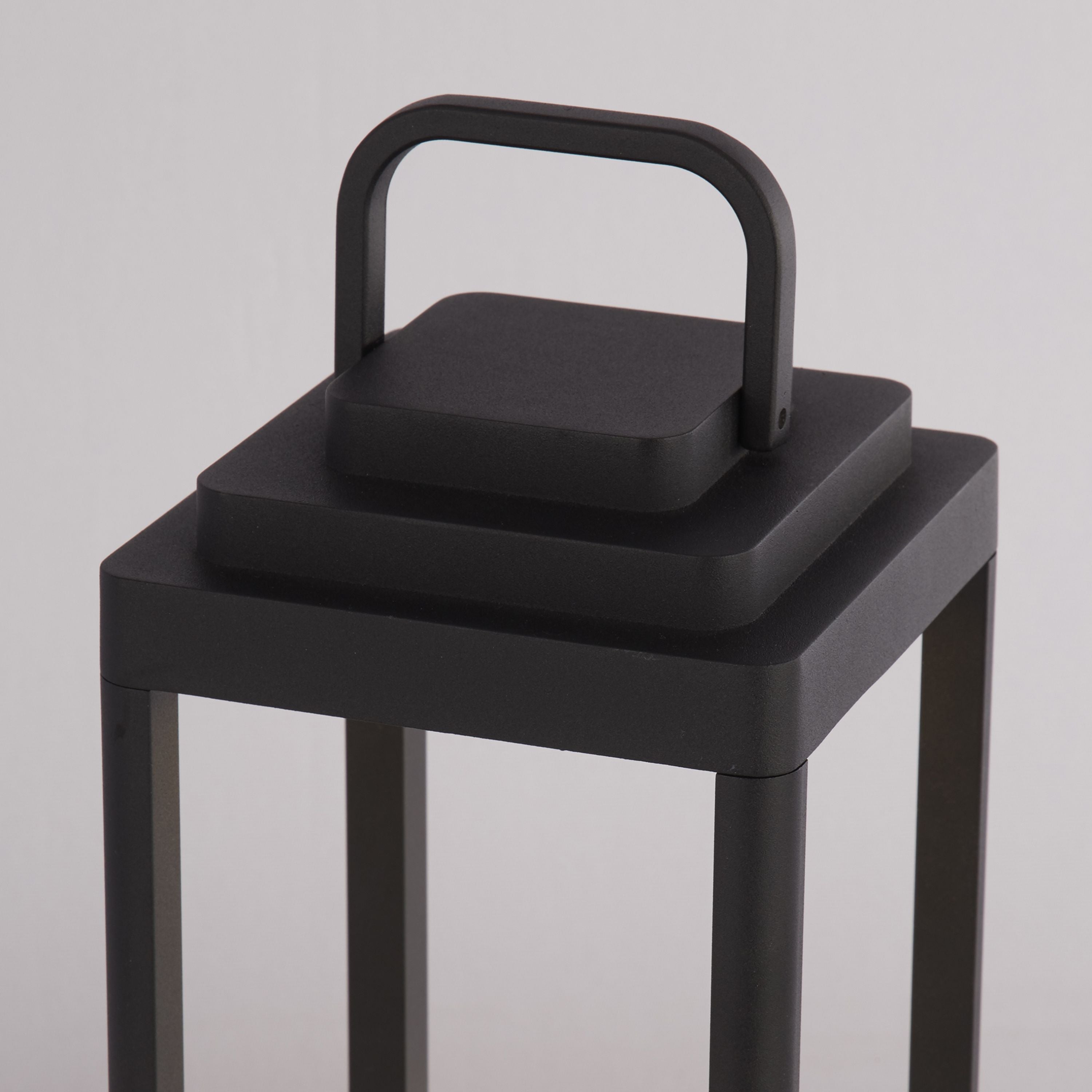 Close up of the Portobello lantern's top handle and black metal frame detail