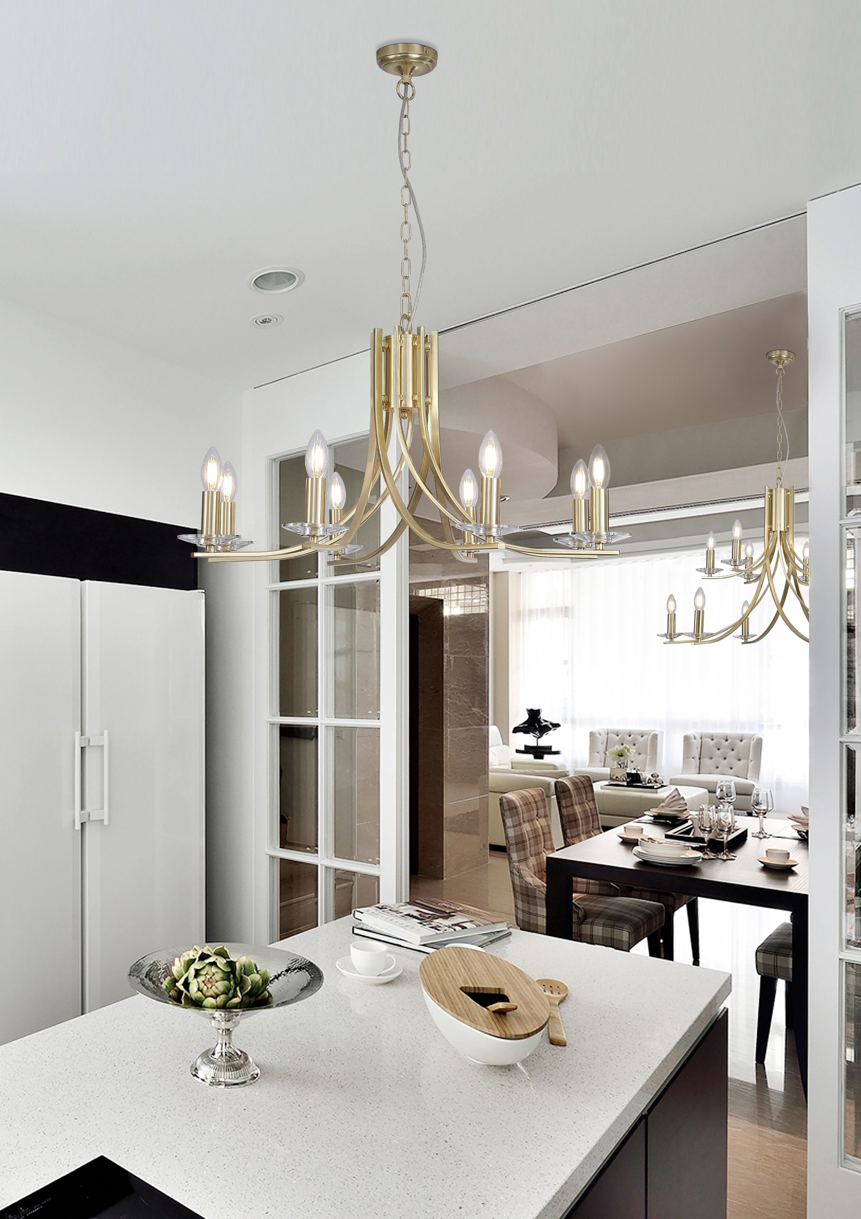 Ascona 8 light pendant in satin brass styled above a kitchen island, with a second matching pendant visible in the dining room beyond