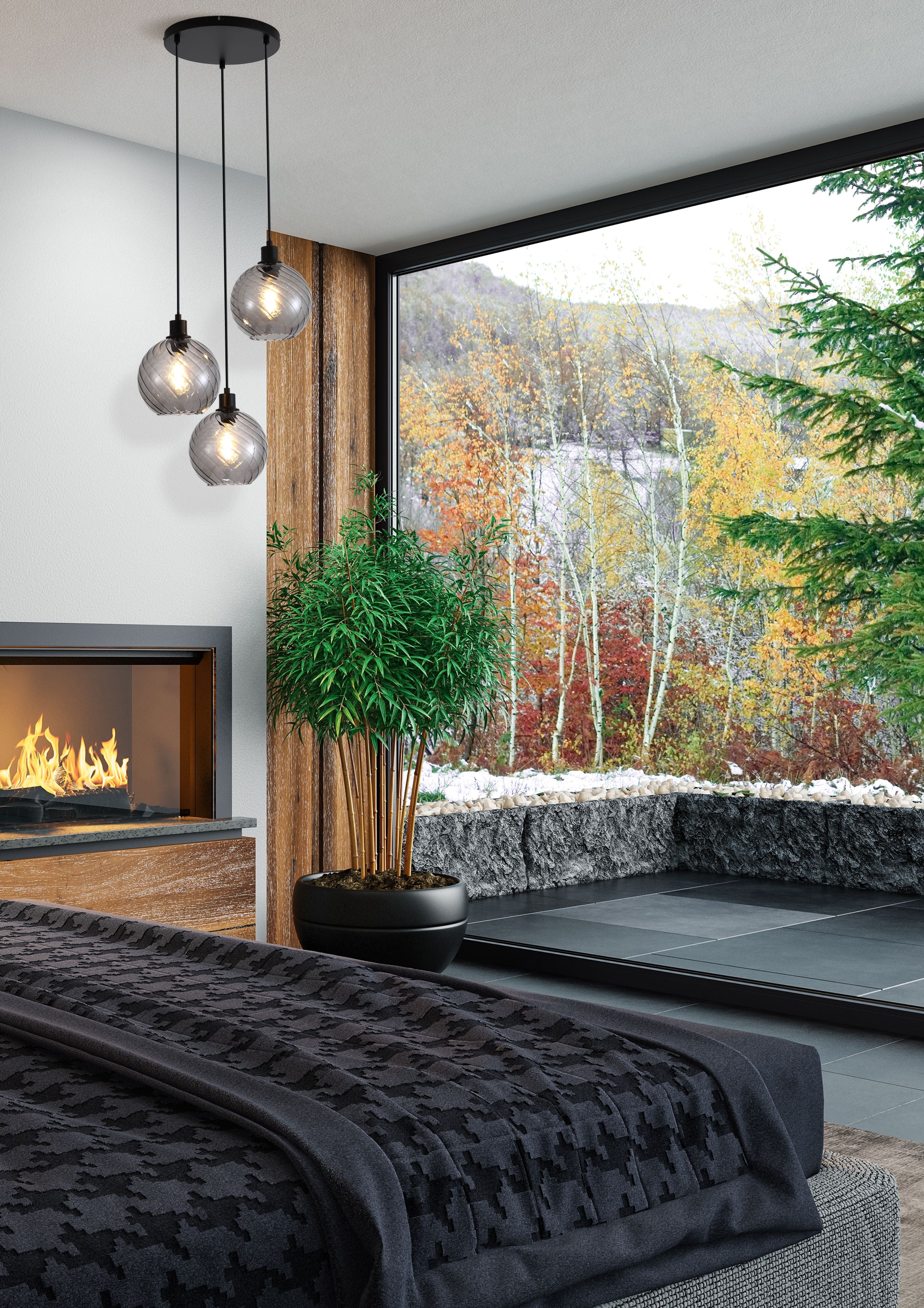 Radiance 3 Light Multi Drop Pendant styled above a bed in a bedroom with a stone fireplace and floor to ceiling window overlooking an autumn forest