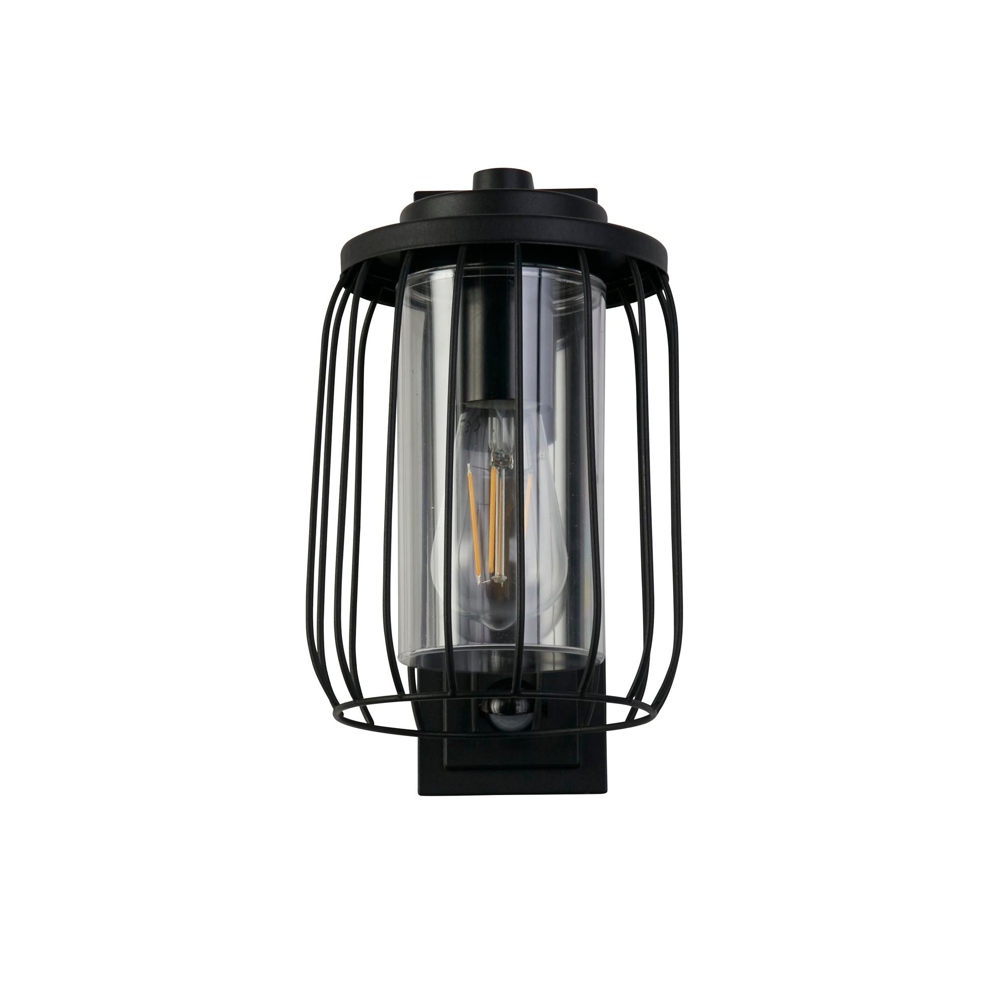 Reed 1 Light Wall Light with PIR in black, alternate front angle showing the wire cage shade and lit bulb inside the clear diffuser.