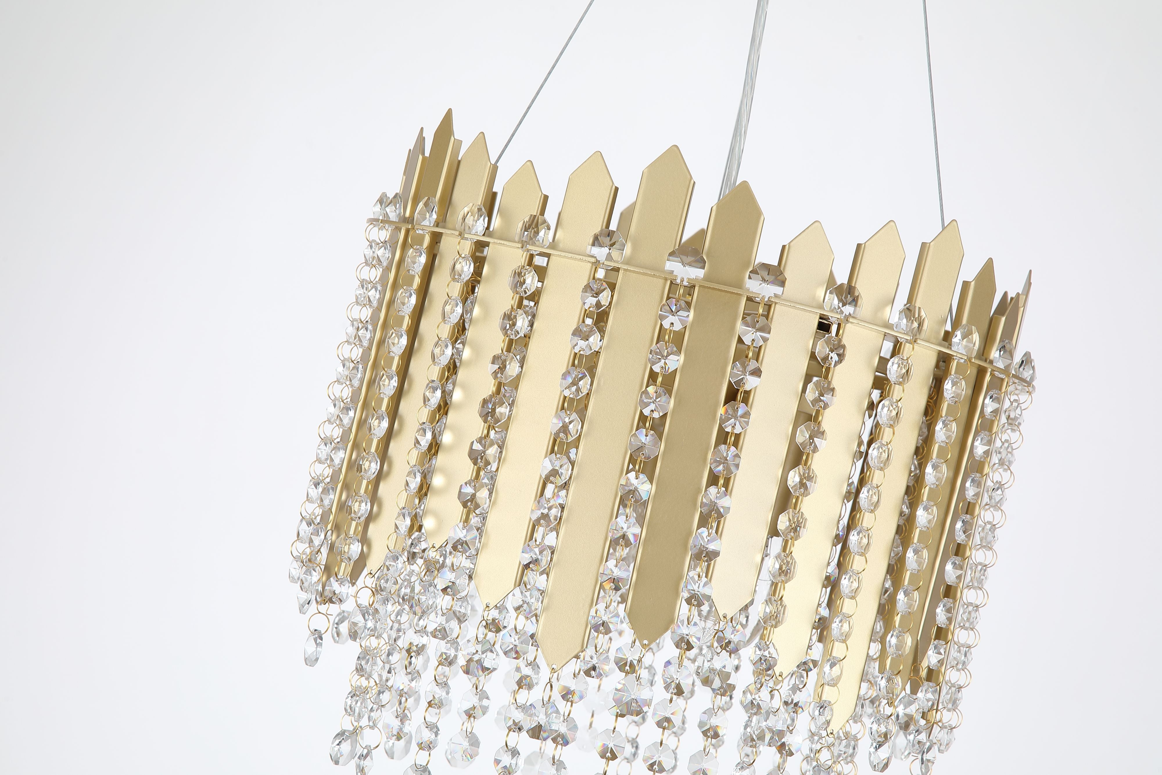 Close up angled view of the Searchlight Spear 5 Light Pendant showing the gold crown shaped panels and cascading crystal octagon beads, illuminated