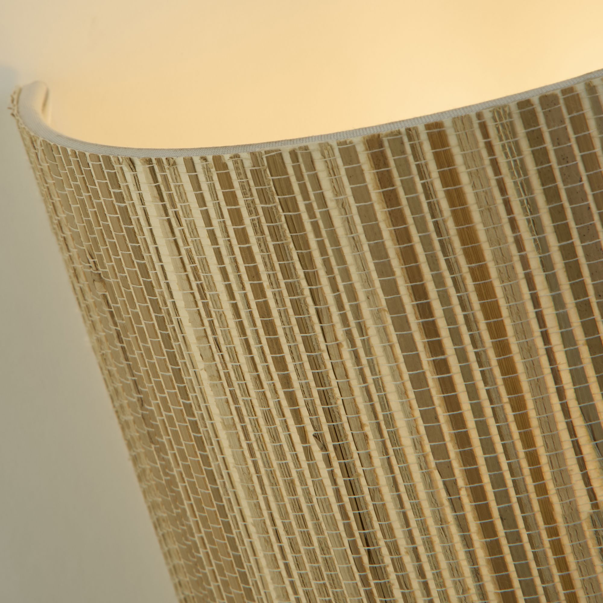 Close up of the natural grass weave along the top rim of the Searchlight Meadow wall light shade
