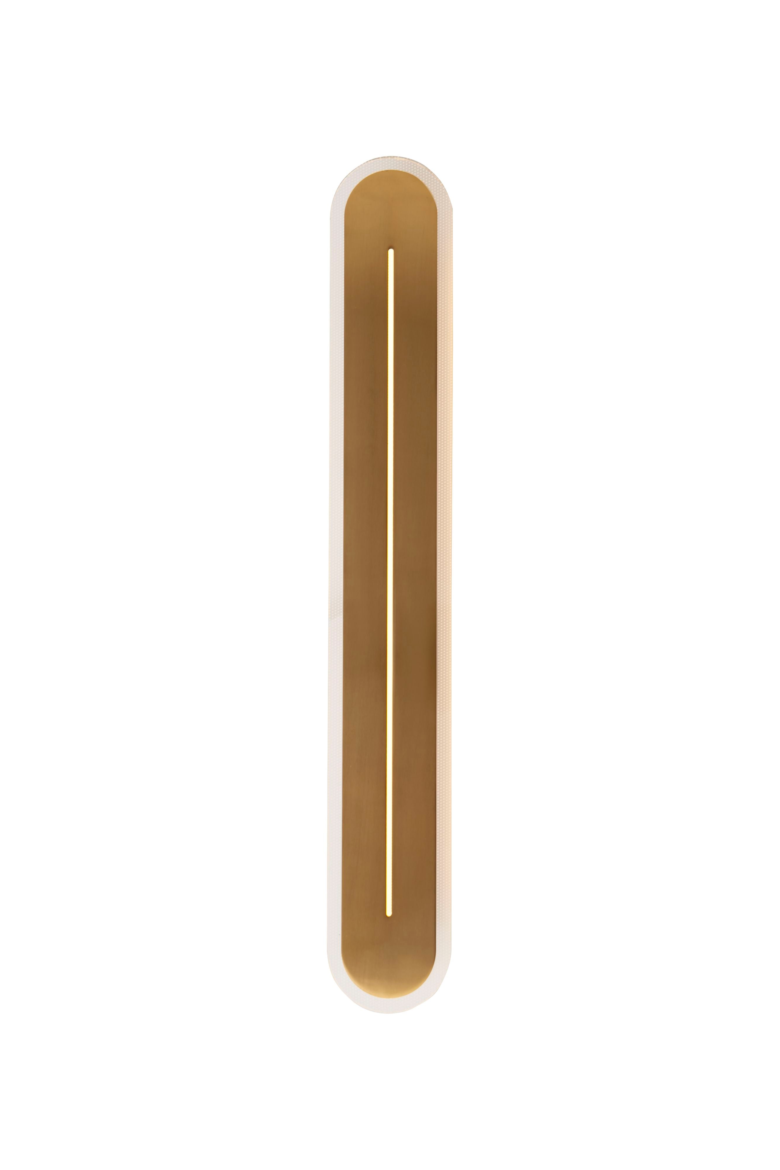 Searchlight Couper LED wall light in satin brass, front on studio shot of the 59cm oval frame with a lit vertical light slit