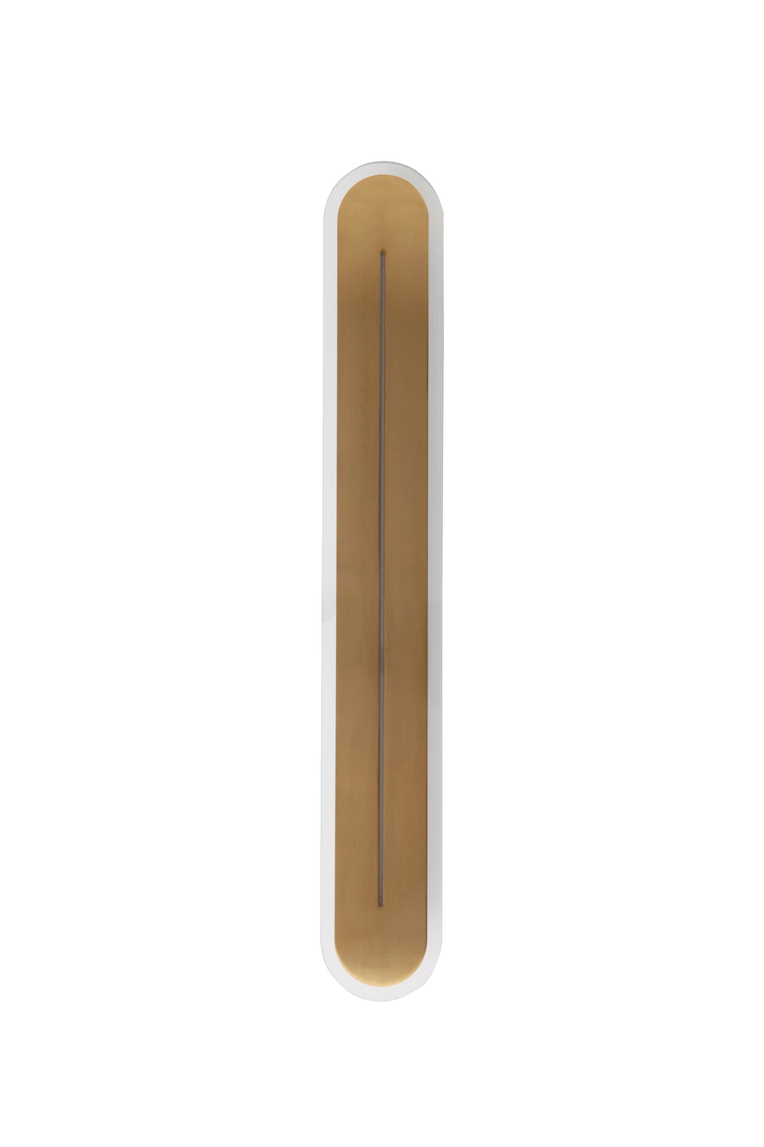 Straight on studio shot of the 59cm Couper LED wall light in satin brass showing the acrylic edge trim and central lit slit
