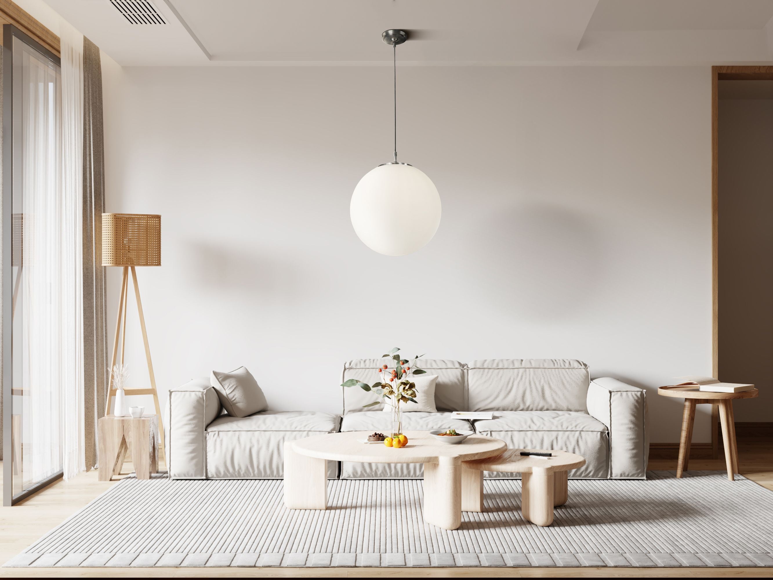 Searchlight Atom Pendant in satin silver and opal glass styled above a coffee table in a light, neutral living room
