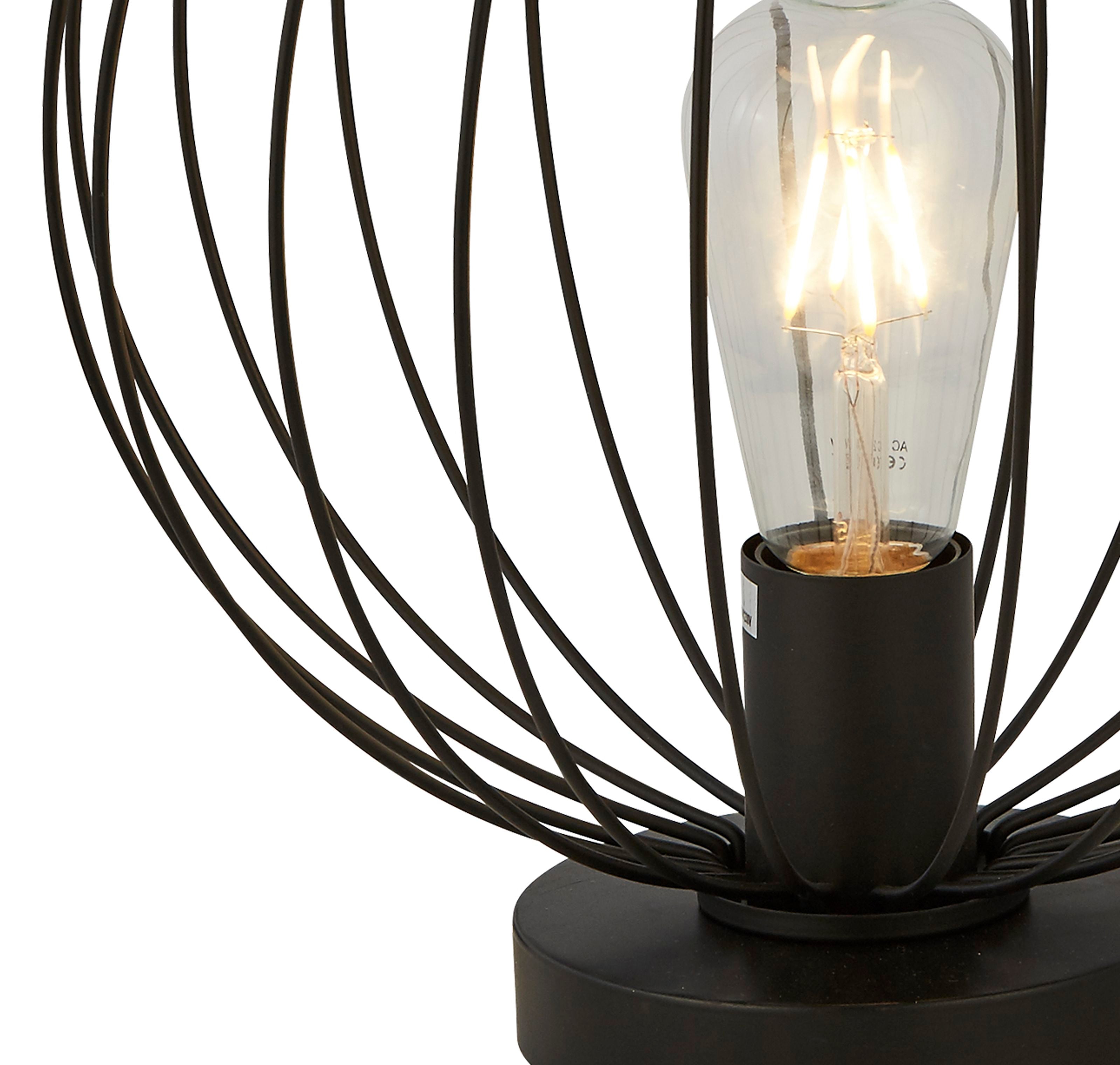 Close up of the Searchlight Rondo table lamp's wire cage shade and lamp holder, showing the filament bulb and the radiating black wire frame