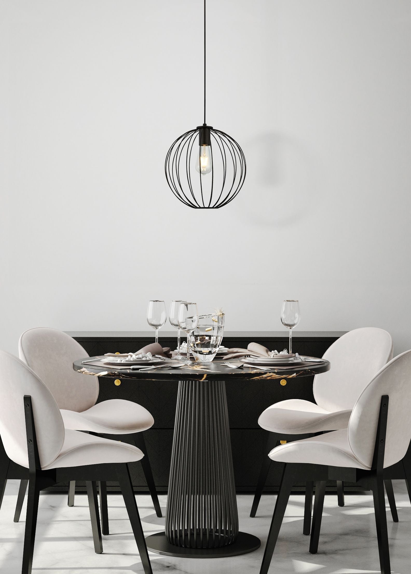 Searchlight Rondo pendant light styled above a round dining table set for a meal, wire cage shade glowing warmly against a plain wall