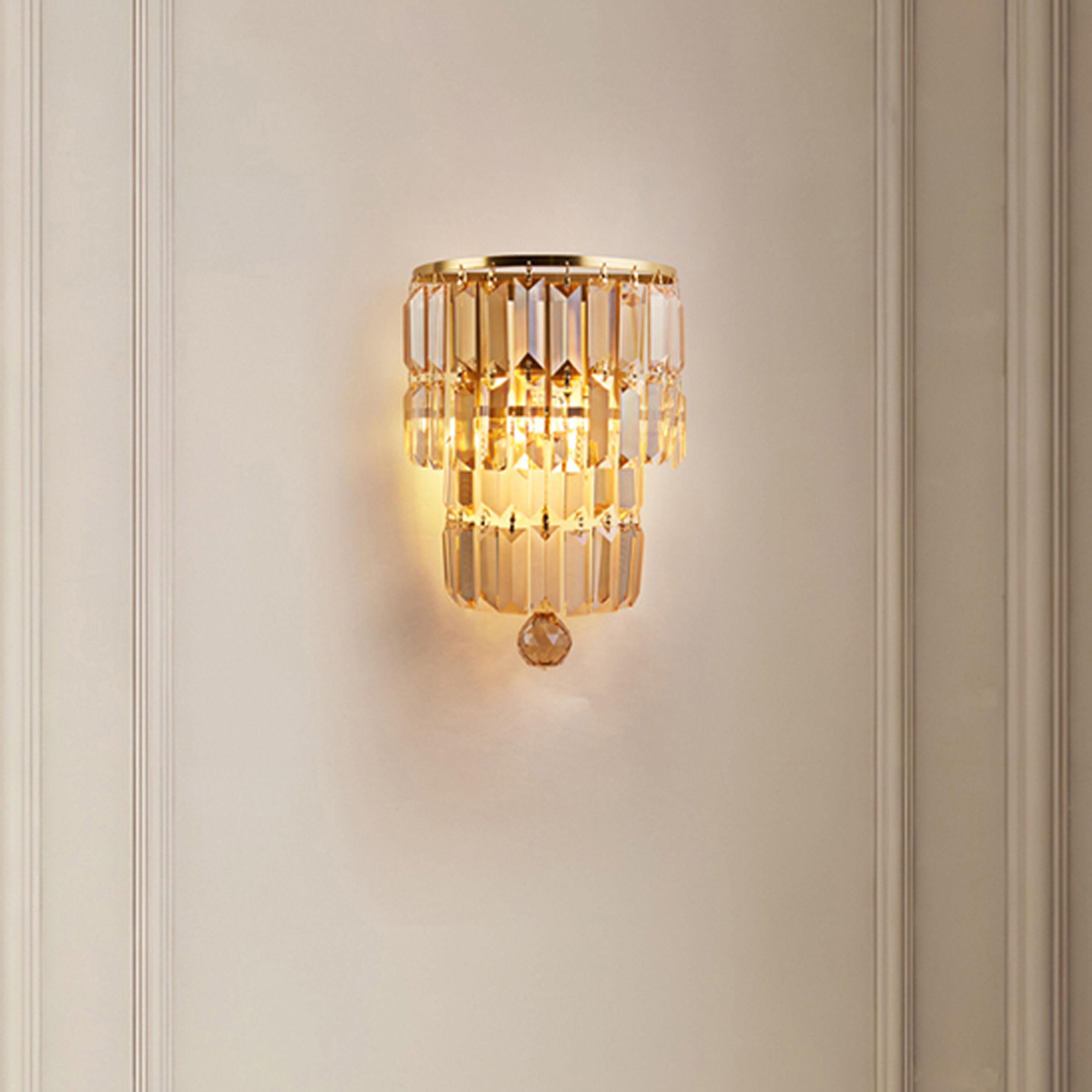 Searchlight Empire 2 light wall light in satin brass and champagne crystal mounted on a panelled wall in a softly lit hallway
