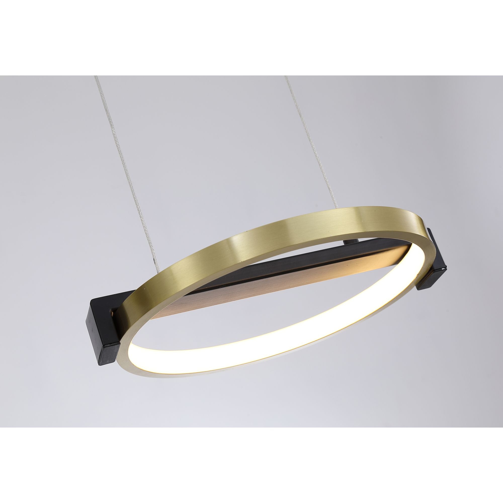Close up of one ring on the Searchlight Aerial pendant showing the brushed gold outer band and black bar with centre fixing, lit warm white