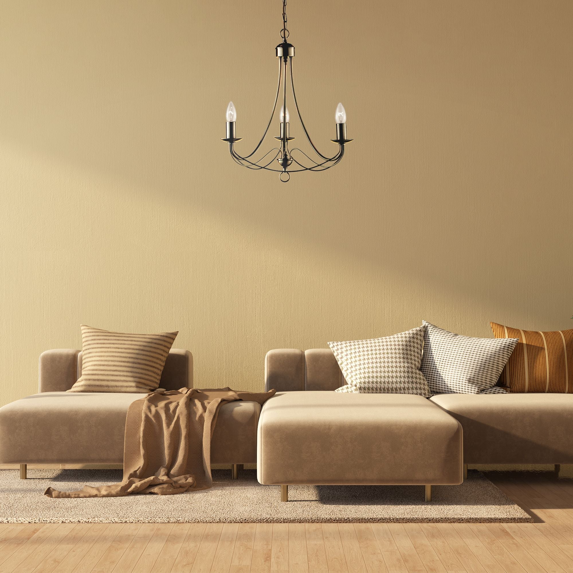 Maypole 3 light pendant styled above a beige corner sofa in a living room setting