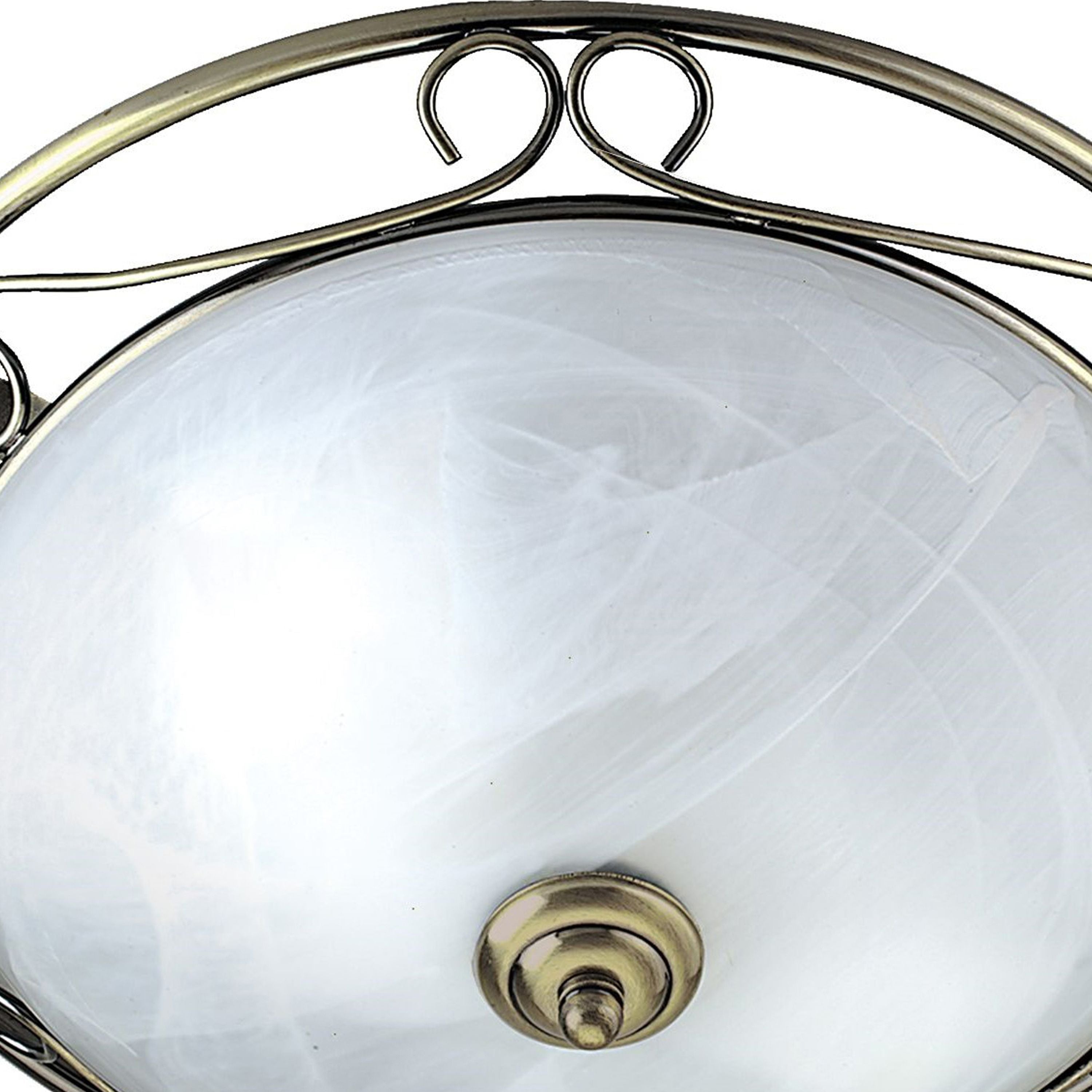 Close up of the antique brass scrollwork detail and centre fixing on the Searchlight Weybridge flush ceiling light