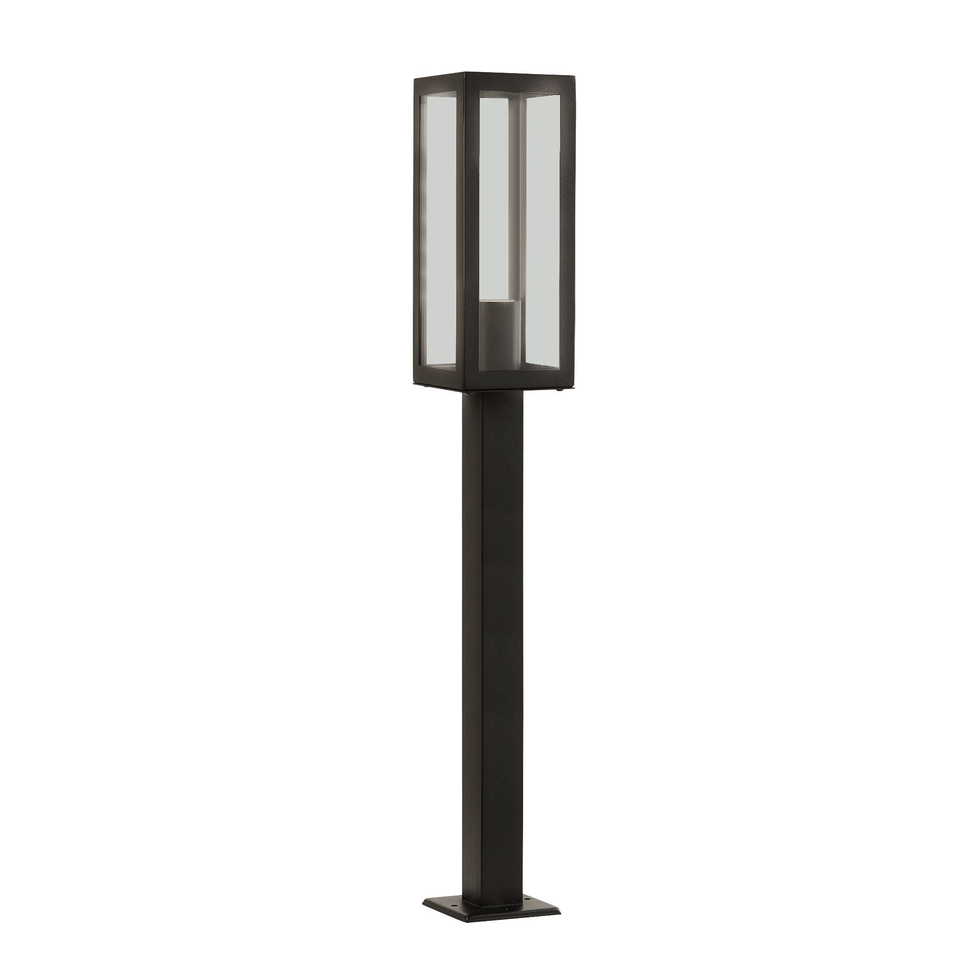 Searchlight Box outdoor post light in black with clear glass panels, shown from a slightly different angle with the exposed bulb lit inside the glazed head